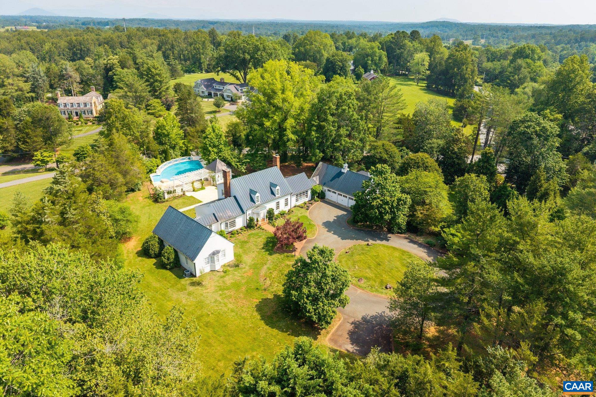 Perfectly positioned on a coveted 2.15-acre corner lot in the heart of Colthurst, 100 Tally Ho Drive is a masterfully reimagined Cape Cod offering over 6,700 square feet of refined living. Almost every inch of this four-bedroom, five-bathroom residence has been thoughtfully renovated with an uncompromising eye for quality, blending classic architectural elegance with modern luxury. Inside, expansive yet intimate living spaces flow seamlessly?ideal for both grand-scale entertaining and everyday comfort. The layout balances form and function, featuring beautifully appointed formal rooms alongside inviting informal spaces, all bathed in natural light and framed by serene views of the surrounding grounds. At the heart of the home lies a chef?s kitchen outfitted with top-tier finishes, opening to gracious gathering spaces and the outdoor terrace. An inviting pool anchors the expansive rear lawn, creating the ultimate outdoor retreat just minutes from UVA, Farmington Country Club, and the best of Charlottesville. With its commanding presence, quiet setting, and comprehensive renovation, this is a rare opportunity to own one of Colthurst?s most distinguished homes.,Marble Counter,White Cabinets,Fireplace in Kitchen,Fireplace in Living Room