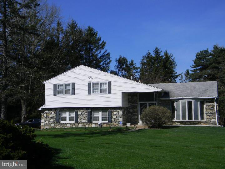 Corner split level with vinyl siding, entry foyer with mirrored double coat closet. Eat in kitchen with natural stone wall, oven does not . As-Is,disposal, stove, dishwasher and sink As-Is.  Living room with newer windows, step up to dining room with built in  cabinets. Steps down from the kitchen to the family room with stone fireplace (never used) door that leads out to covered patio. Power room and laundry room on lower level. Full basement partially finished , cedar clost and large utility room and bar. Main bedroom with walk in closet, master bath with stall shower, 3 other good size bedrooms.