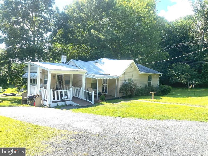 Back on the market. Buyer's financing is shaky. .. Wow!  All three parcels are included in the sale of this property. Tax id # 17070738948, 17070680280 & 17070821553. Combined it's approximately 2 acres. Looking for a country living feel?  This property is being sold As-IS.  This 1-level rambler has a newly built composite porch, A total of 2 bedrooms, and 2 full baths. The owner's suite and owner's bath were constructed as an addition that features 1 of the 2 bedrooms and bathrooms, a walk-in closet, and large windows. The kitchen has newer countertops and stainless steel appliances. This home also has a newer roof,  gutter leaf guards, and a generator (Propane). Well water and septic tank. This is an estate sale. Property sold AS-IS!