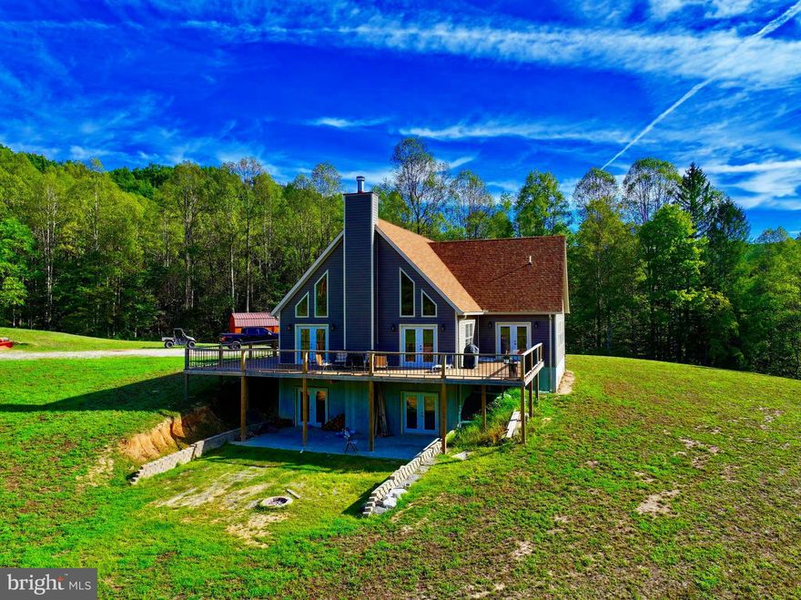 "Breathtaking Home Surrounded By The Appalachian Mountains" Over 5,000 sq.ft. home situated on 50 +/- ACRES in the middle of West Virginia. Paved county road frontage leads to a freshly graveled driveway over the spring fed creek, passing the pond, and up to the home for panoramic views in all directions. Built in 2021 this home features free gas, heated floors, 2 fireplaces, 4 bedrooms, & 4 bathrooms. Enjoy the solid hickory wood floors and tongue & groove knotty pine ceilings. To the living room to turn on the gas fireplace for a comfortable winter evening or enjoy the natural sunlight from the many windows in all seasons. Expansive kitchen built with solid handmade hickory cabinets & commercial grade appliances. Up to the loft to the main bedroom featuring vaulted pine ceilings, large attached closet, bathroom, & garden tub. Enjoy your favorite drink from the over sized wrap around deck watching sunrises & sunsets. 6 cleared acres for pasture with multiple other home sites surrounded by 40 +/- acres of marketable poplar, oak, & hickory. Trail system through the property for riding & hunting. Wildlife is overly abundant here including deer, turkey, bear, and much more. Fully finished basement featuring grand gathering room with fireplace, 2 full bathrooms, multiple bedrooms, office & storage space. 3 stall detached garage featuring unfinished 18X40 bonus room above plumbed for water & gas. A recreational paradise with a new canvas ready for customization for your needs. Call for your private showing today! 3 miles to Sue Morris Sports Complex. 5 miles to Glenville State University. 12 miles to Cedar Creek State Park. 20 miles to Burnsville Lake. 30 miles to Stonewall Resort. 30 miles to Flatwoods. 60 miles to Clarksburg/ Bridgeport.