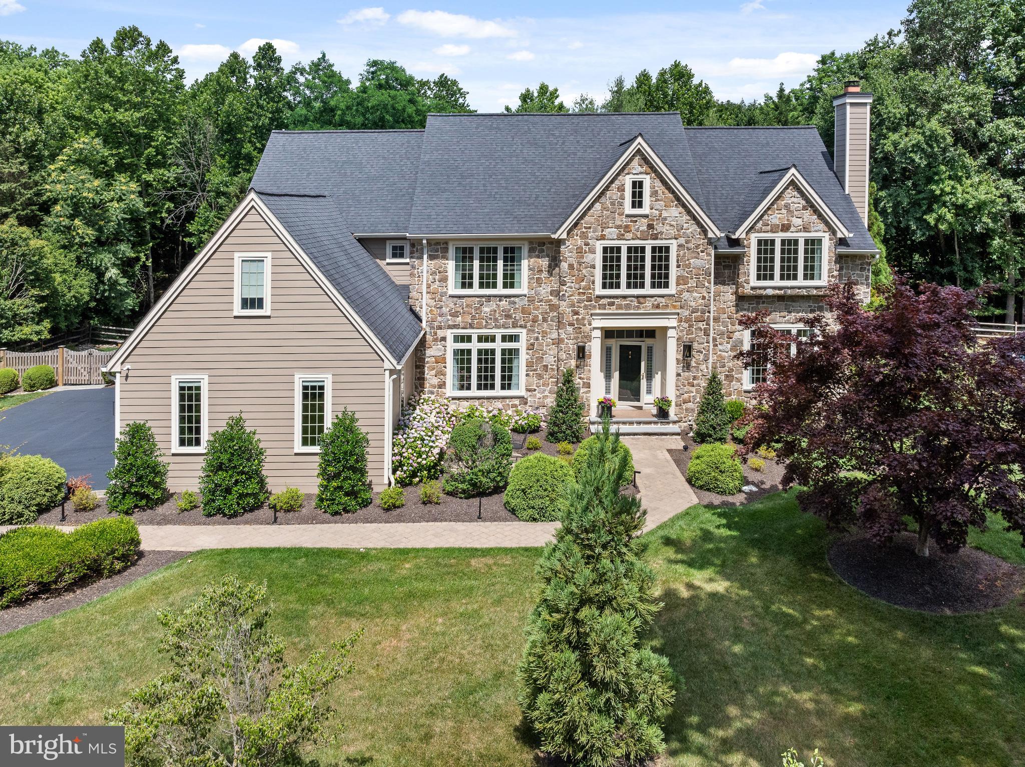 Nestled in the prestigious Treyburn community of Tredyffrin Township, the stunning property at 820 Dresher Way epitomizes luxury and sophistication, beautifully situated before the end of a quiet cul-de-sac. This location combines the benefits of serene, private living with the convenience of a close-knit community atmosphere. The home itself, owned by the original owner since its construction, has been meticulously maintained, loved, and updated, reflecting a commitment to quality and comfort. Upon entering, guests are greeted by an impressive Foyer showcasing exceptional millwork, soaring ceilings, and a sweeping butterfly staircase, setting the stage for the home's refined aesthetic. The Foyer opens onto gleaming hardwood floors that continue throughout the First Floor, adding warmth and a seamless flow to the layout. The elaborate millwork and hardwood floors together create an air of distinguished craftsmanship and timeless beauty. Adjacent to the grand Foyer, the formal Living and Dining Rooms are the epitome of elegance, perfect for hosting gatherings with fine moldings and abundant natural light that enhances the ambiance. Also on the First Floor is a private Office, both functional and stylish, featuring handsome built-ins that provide ample storage and display options, ideal for a quiet study or conducting business. Just beyond the formal spaces, the home reveals its true centerpiece: a brand new gourmet Kitchen. This culinary haven is equipped with top-of-the-line appliances, custom cabinetry, and sleek quartzite countertops. Designed for both serious chefs and family gatherings, it opens seamlessly into a stunning two-story Family Room. This expansive area is notably enhanced by striking arched beams across the ceiling, adding architectural interest and a touch of elegance. Large windows in the Family Room illuminate the space with natural light and offer captivating views of the lush backyard oasis. Conveniently located between the formal and informal living spaces, an elegant Powder Room adds a touch of sophistication and convenience, serving both guests and family members with style and accessibility. Additionally, the First Floor includes a Laundry Room and a Mudroom, which provides practical daily conveniences and easy access to the Three-Car Attached Garage. Upstairs, the Primary Suite provides a luxurious retreat, complete with a spa-like marble Bathroom, Sitting Room, and a spacious walk-in closet. Continuing on this floor, there are three additional Bedrooms, each freshly carpeted with new, plush carpeting that adds warmth and comfort underfoot. One of these is an en suite with a newly installed Bathroom, offering privacy and modern comforts. The other two Bedrooms are equally well-appointed and share access to a brand new, beautifully designed Hall Bathroom. The Lower Level of this home extends the living space with natural daylight enriching a versatile area that includes a movie viewing room and a convenient powder room, perfect for entertainment and relaxation. Outside, the property features a magnificent Pool and a charming Gazebo, making it a perfect setting for relaxation or entertainment. The meticulously designed Deck and Patio are ideal for al fresco dining and enjoying the serene surroundings. With its combination of privacy, security, and accessibility to local amenities, 820 Dresher Road is an exceptional choice for those seeking a tranquil yet convenient lifestyle in a vibrant community. This home's enduring appeal is a testament to the loving care it has received throughout its history, making it a truly remarkable place to live. Don't miss this gem....showings begin WEDNESDAY JUNE 26th.