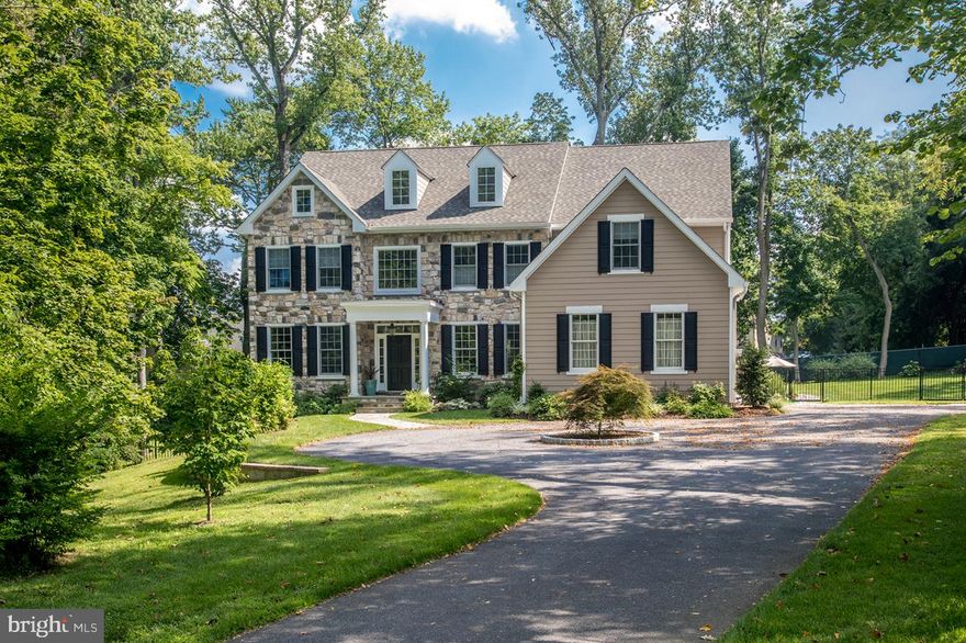 The feeling of home sweet home beckons in this beautiful Center Hall Colonial on 1.2 lush acres of manicured grounds with large trees, lush lawn and an in-ground swimming pool with spa! Set way back from the road down a private tree-lined drive, 223 Buck Lane is a vision of elegant living in a prime Haverford locale. A wide circular drive receives your guests  and family s cars, and is an inviting welcome to a wonderfully appointed, impeccably maintained home. An airy double-height reception hall awaits beyond the main front doors, showcasing classic elements like gleaming hardwood floors, tasteful moldings, wainscoting, and wide arched case openings to main rooms. A light-filled living room and formal tray ceilinged dining room enriched by custom millwork sit to the left and right. Connected to the dining room for easy serving is a butler s pantry and gorgeous granite and stainless-steel kitchen, with every amenity for the chef and a breakfast area for casual dining. Glass doors open to the fabulous enclosed deck with a vaulted wood beamed ceiling, built-in grill, and huge sliding screened doors to the pool patio for seamless indoor-outdoor parties. Adjacent to the kitchen is a soaring open family room with a gas fireplace, wet bar, built-in entertainment center, and double-tier windows inviting in beaming sunshine. Also on this level is a powder room and mudroom/laundry room accessing the attached 3-car garage. Ascend the main or rear stairs to an open catwalk that leads to the 4 spacious bedrooms (2 on either side) and 3 full baths that occupy the second level. The elegant master suite is a relaxing retreat with coffered ceilings, a separate vaulted sitting room/office, and big his/her walk-in closets. Have a spa-like experience in the luxurious master bathroom featuring his & her vanities, a soaking tub, oversized glass-enclosed shower, and separate water closet. Other highlights are a beautiful wine cellar and a finished walk-out lower level with a game room, bedroom, full bath, French doors to the paver patio and fenced rear yard, storage shed, and a full house generator. Enjoy the ultimate privacy, and space for every occasion, at an idyllic address near it all: shopping, dining, Merion Golf Club, the Haverford School, King of Prussia, the R-5 train, major roadways, Center City and the airport.