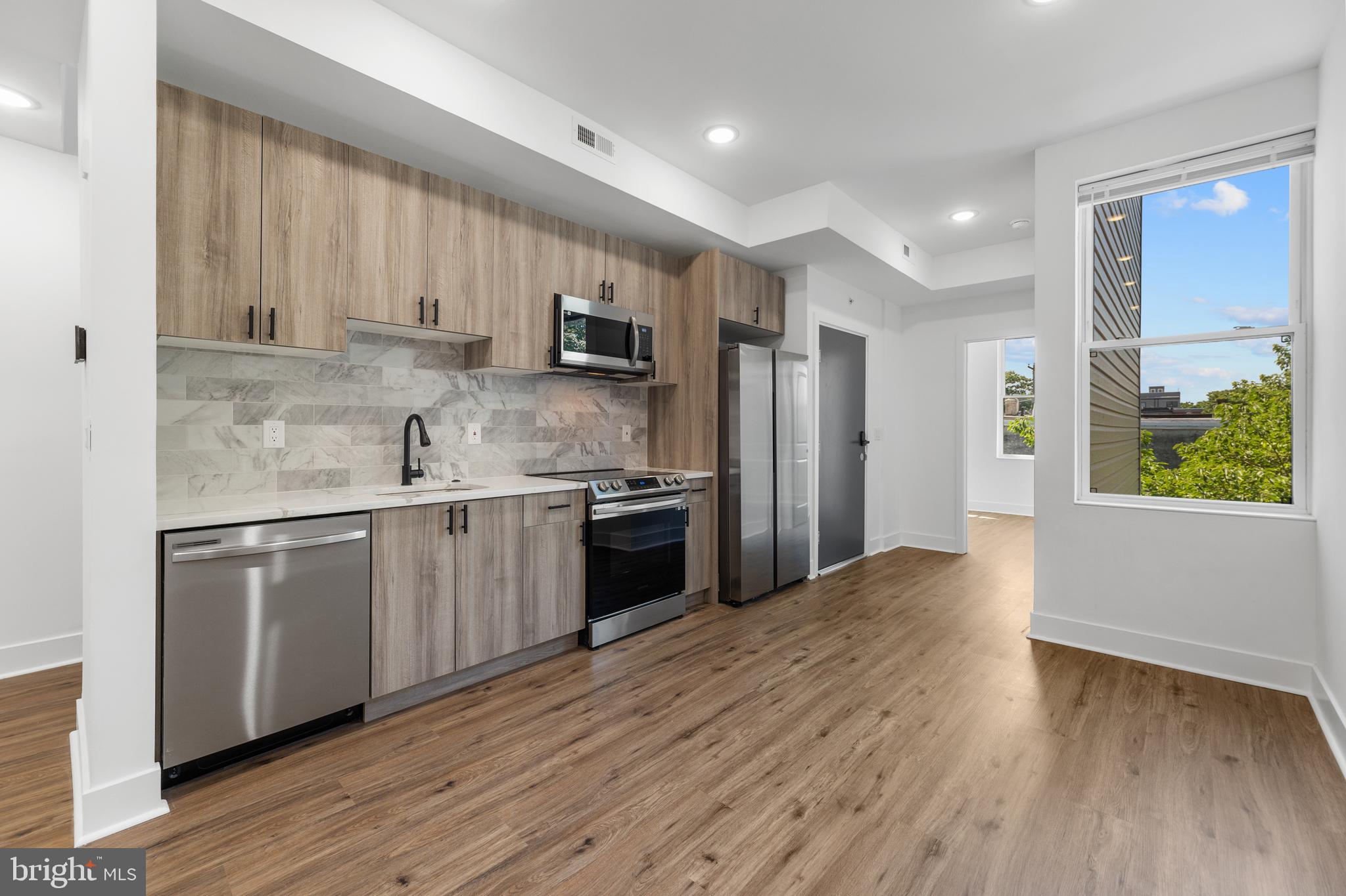 PRIVATE ROOF TOP DECK! Welcome to 3934 W Girard Avenue Unit 2, a charming brand-new 2-bedroom, 2-bathroom apartment in West Philadelphia. Step inside to find a beautiful spacious open-concept living room and kitchen area with recessed lighting and matching hardwood flooring throughout. The chef-inspired kitchen is a culinary delight, featuring sleek cabinetry, stainless steel appliances, a stylish tile backsplash, and a large dining area. The two spacious bedrooms, on each end of the unit, are thoughtfully designed with large windows that fill the rooms with natural light. The bathroom includes a sleek glass-door shower/tub combination and a substantial vanity with ample under-sink storage. Additionally, this unit includes a washer/dryer and boasts a rooftop deck with beautiful skyline views, providing a perfect retreat for relaxation and enjoyment. Call for a showing today.
Tenants responsible for electricity.