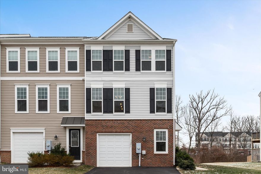Beautifully appointed town home in the sought after Fieldstone neighborhood.  Tons of upgrades including granite counters, 42" cabinets, hardwood floors, fireplace in family room and large rear deck.  Freshly painted and new carpet installed! This end unit features a fantastic open floor plan with gourmet kitchen and large center island.