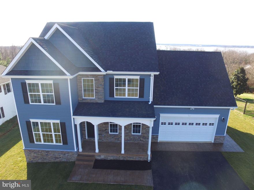 New construction without the wait! This Gorgeous Water View home is complete and ready to move in. You will be blown away with the upgrades including a Stone front, Stamped concrete covered front porch, Stamped concrete sidewalks, Shake siding gable and Fully Sodded front and back yard.  "The Duke" features 4 bedrooms, 2.5 baths with an unfinished basement. Granite counter tops, stainless steel appliances, eat-in kitchen, separate dining room, separate office/study,  granite dual vanity in master bath with soaking tub, separate glass enclosed shower and walk-in closet. Convenient upper level laundry with folding station. Enjoy the beautiful views of the Potomac River! There is  no HOA and this property is Eligible for 100% financing through USDA Rural Development (if qualified).