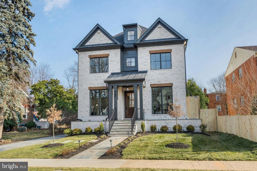 Modern Luxury Meets Timeless Craftsmanship in the Heart of Clarendon
📍 Clarendon | 🛏 6 Bedrooms + Studio bedroom | 🛁 6.5 Baths | 📐 Approx. 6,025 Sq Ft | 🚗 Detached 2-Car Garage w/ ADU |  New Construction

Welcome to your dream home nestled on a picturesque  lot in the heart of Clarendon, one of Arlington's most sought-after neighborhoods. This brand-new construction by MR Custom Homes blends classic elegance with contemporary design across four beautifully finished levels—plus a separate studio suite above the garage—offering the perfect balance of space, sophistication, and smart functionality.

Exceptional Exterior Details:
Crafted with James Hardie smooth siding, a brick front veneer, and Tamko architectural shingles, the home is as durable as it is stunning. Step up to the flagstone front porch, admire the professionally landscaped grounds, and enjoy peaceful evenings on the rear screened porch featuring ceiling heaters, speakers, and a gas line ready for your grill. The two-car detached garage includes a fully finished studio/office ADU with a rough-in for a 240V EV charger—ideal for guests, rental income, or remote work.

Light-Filled Living Spaces:
Inside, soaring 10' ceilings on the main level and 9' ceilings upstairs create an airy, open feel. The gourmet kitchen is a chef’s delight, with custom inset maple cabinetry, 2.5" Quartz countertops, and top-of-the-line appliances including a 48” Wolf gas range and Sub-Zero fridge. Entertain in style with a butler’s pantry, large center island, and breakfast nook that flows seamlessly into the family room with a 48” linear gas fireplace and ceiling beams.

Thoughtful Floor Plan:
With 6 bedrooms, 5 full baths in the main house, and a powder room, this home was designed with flexibility and comfort in mind. The first floor features a private library with built-ins, formal dining, and a mudroom with custom cubbies. Upstairs, the luxurious primary suite includes a tray ceiling, spa-like bathroom with heated floors, soaking tub, frameless glass shower, and a massive walk-in closet. The second floor also hosts a laundry room with a sink and three more bedrooms—including a Jack & Jill layout and one en-suite.

The 3rd-floor loft offers additional living space with a wet bar, bedroom, and full bath—perfect for multi-generational living, guests, or play space.

Lower Level Retreat:
The expansive finished basement includes a rec room with a wet bar, exercise room, in-law suite, and a finished storage room. The flooring throughout is both beautiful and practical: White Oak hardwoods, luxury vinyl tile, rubber gym flooring, and premium carpeting.

The ADU above the garage has a private entrance,  full bath, kitchenette, separate heating/cooling & lots of closet storage.

High-End Systems & Smart Features:
Built with energy efficiency in mind, the home includes Andersen 400 Series windows, upgraded insulation (R-49 attic, R-15 walls), a ProLine XE 75-gallon water heater, and zoned Carrier HVAC with Aprilaire air filtration and humidifier. Tech-savvy buyers will appreciate CAT6/RG6 wiring, Ecobee doorbell camera, built-in ceiling speakers in key rooms, and 400-amp electric service.

Built by the Trusted 3rd Generation Builder, MR Custom Homes, this property comes with a full 1-year warranty, plus structured pre-settlement walkthroughs and service appointments for your peace of mind.

📞 Don't miss this rare opportunity to own a true showpiece in Clarendon.  Home is completed and ready for its new owner.