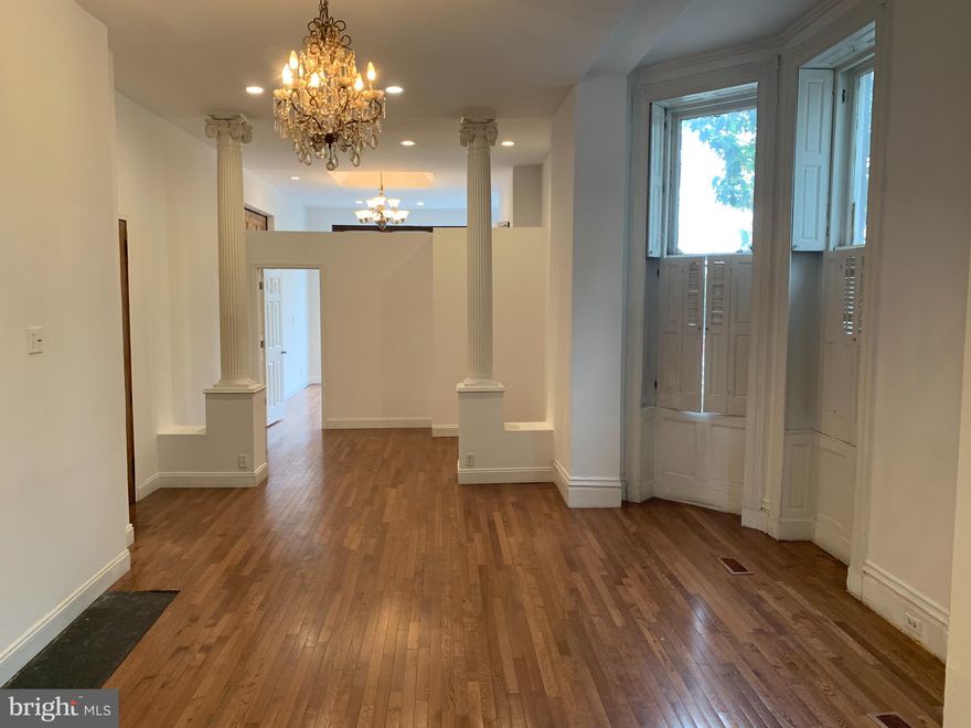 FOR RENT: Huge 1 bedroom plus den apartment in the popular Station North Arts & Entertainment District.  At 1100 square feet, this apartment offers the space of a 2 bedroom unit, but features a loft-like feel with a separate bedroom, and open layout of the living room and den/office area. Light filled, end unit with high ceilings and hardwood floors throughout. Beautiful mix of original details and modern conveniences.  Large gourmet kitchen with granite counters and center island.  Modern high efficiency heating and cooling system. Washer/Dryer in unit. Professionally managed. Great location close to Penn Station, University of Baltimore, MICA,  downtown, and Station North's bars, restaurants and theaters.