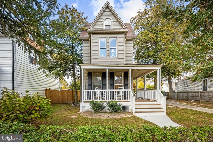 Built in 1900, this enchanting storybook Victorian is framed by mature trees and dappled light, welcoming you with its gracious wraparound porch—a perfect spot to sip cider and watch the leaves drift down on a cool autumn day. Step inside and feel the warmth of beautifully refinished original hardwood floors, tall ceilings, and the soft glow of stained-glass windows casting color across the living room’s original decorative fireplace and mantle.

The newly renovated kitchen blends classic style with modern comfort, featuring white Shaker cabinets, quartz counters, and generous prep space for cooking or gathering. The separate dining room invites memorable evenings—picture candles glowing, friends lingering over dessert, and conversation that carries late into the night.

Upstairs, you’ll find three inviting bedrooms, two full baths, and abundant closet space, plus a sunny third-floor bonus room that’s ideal for an art studio, home office, or peaceful hideaway—along with plenty of attic storage.

Out back, a deck opens to a wide, deep yard that’s perfect for cool fall evenings around a firepit. A wide driveway provides parking for up to four cars, and a spacious storage shed offers endless potential—whether you envision a workshop, potter’s shed, or future garage.

Steeped in character yet refreshed for modern living, this gracious Victorian invites you to begin its next chapter—with warmth, beauty, and charm at every turn.