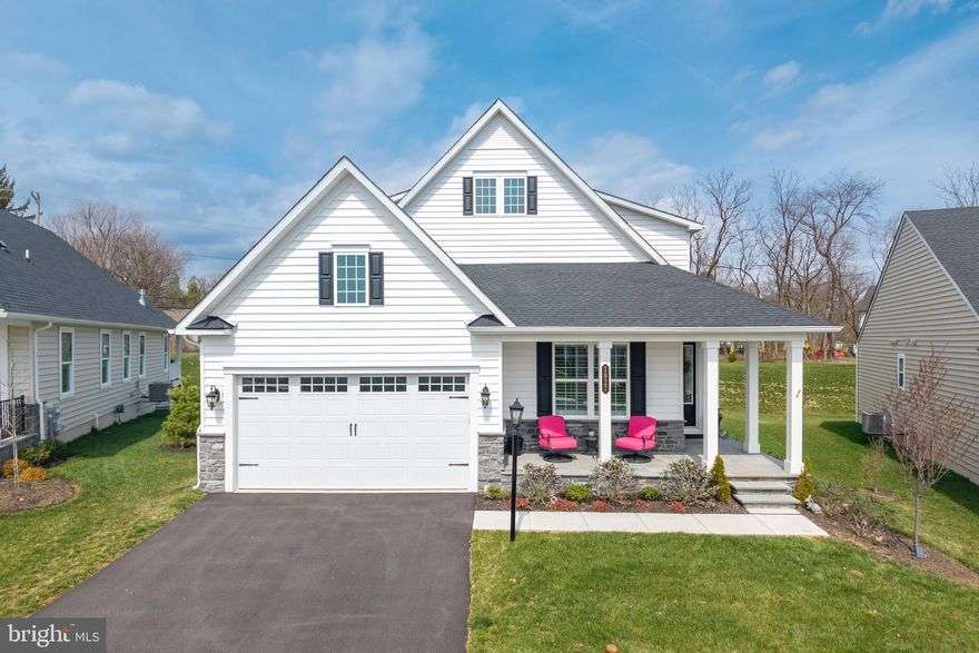 Tucked away on a quiet enclave within the sought-after Greystone community in West Goshen, this stunning 4-bedroom, 4-bath NV Homes Clarkson model sits on a premium lot with no through traffic, offering both privacy and a peaceful setting.
Built less than two years ago and thoughtfully enhanced well beyond the builder’s model, this home is filled with elegant upgrades, custom finishes, and beautiful crown molding and detailed woodworking throughout.

The main level features a bright, open layout with wide plank flooring, a spacious living area, and a beautifully designed kitchen with an oversized island, upgraded cabinetry, stainless steel appliances, and a clean, timeless aesthetic that flows seamlessly into the dining and gathering spaces. Natural light pours in through multiple windows, creating a warm and inviting atmosphere.

The main floor primary suite offers a true retreat, highlighted by a tray ceiling, generous proportions, and a spa-like bath with a double vanity, sleek finishes, and a large glass-enclosed shower. Two additional well-sized bedrooms - one on the main level and one on the upper floor - provide comfort and flexibility. The upper level continues to impress with a bright, spacious loft perfect for relaxing or entertaining, along with a versatile bonus room ideal for a study, gym, media room, or creative space.

The fully finished lower level is an entertainer’s dream, complete with a custom-built bar featuring cabinetry, sink, refrigerator, and dishwasher, along with multiple areas for lounging, dining, or hosting. An additional finished room provides the fourth bedroom along with a full bathroom, making it ideal for guests, extended stays, or a private retreat.

Step outside to enjoy the expansive rear deck with a covered section and electronic awning, perfect for relaxing or entertaining while overlooking the backyard.

One of the standout features of this home is the fully paid $50,000 Neighborhood Improvement District (NID), offering significant savings compared to other homes in the community.

With its premium location, thoughtful upgrades, and move-in ready condition, this home offers a level of finish and comfort that truly stands apart.