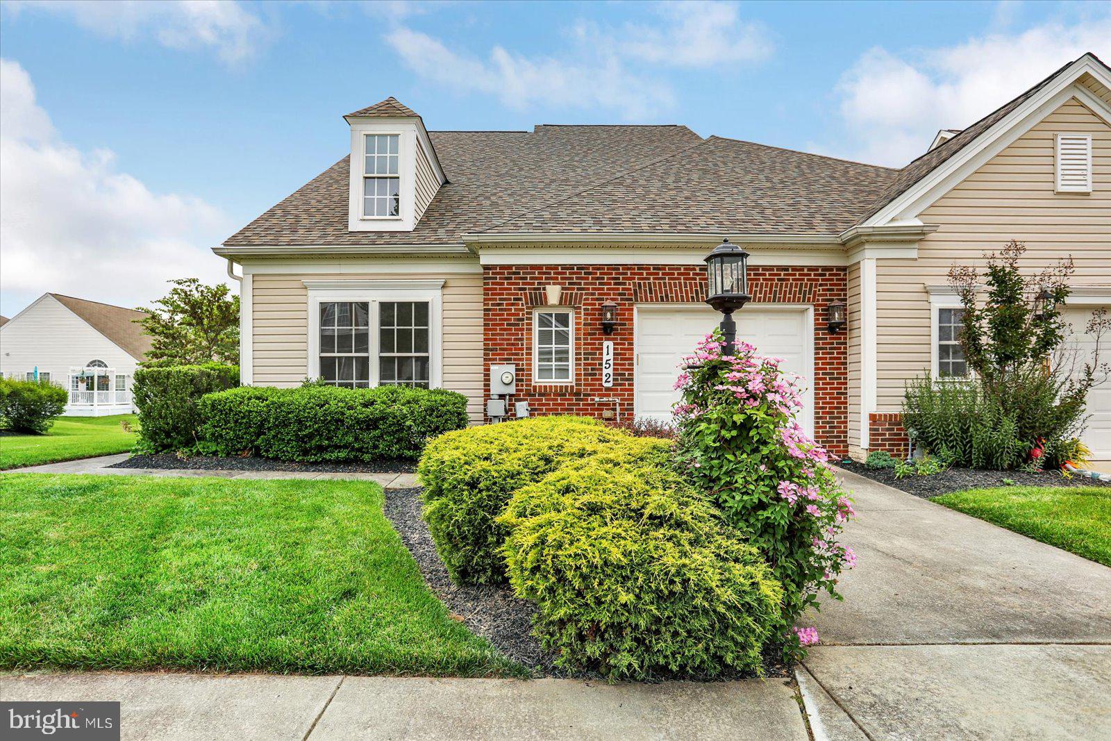 Welcome to over 1,600 square feet of thoughtfully designed living space in the sought-after 55+ community of Carroll Vista. This beautifully maintained end-unit townhome combines charm with the ease of elegant one-level living. Inside, you'll find a bright, immaculate layout featuring a formal dining room accented by chair rail and crown molding, along with ceiling fans in all bedrooms for year-round comfort. The spacious eat-in kitchen offers ample cabinetry, stainless steel appliances, and a cheerful, welcoming atmosphere. A bonus room with glass French doors provides the perfect space for a home office, reading nook, or hobby room. Step outside to a private paver patio—an ideal spot to relax and enjoy the outdoors. The home includes a well-appointed primary bedroom with ensuite bath, a second bedroom, and a full hall bathroom. Additional highlights include a large laundry room, an attached garage, a concrete driveway, and abundant guest parking nearby. Carroll Vista’s exceptional amenities include indoor and outdoor pools, a hot tub, sauna, clubhouse with library, billiards room, ballroom, craft and card rooms, a fitness center, indoor golf simulator, and a 4-hole putting green. Outdoor recreation includes tennis, pickleball, basketball, bocce, shuffleboard, and scenic walking trails with ponds, butterfly gardens, benches, and a gazebo. With regular events, fitness classes, and planned outings, Carroll Vista offers more than a home—it offers a vibrant, active lifestyle.