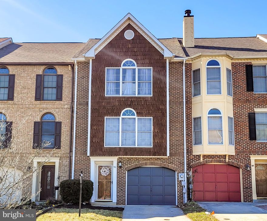 Three  finished levels of living space!  Open floor plan on main living level including eat-in kitchen with cooktop island and stainless steel appliances that opens to rear deck, and huge sun-filled living room with  large Palladian window. Three large bedrooms, including one on entry level, all with private/attached bathrooms.   New luxury vinyl plank flooring in kitchen, powder rooms and entry foyer.  Convenient one car attached garage with opener, concrete driveway and two additional parking spaces in front of unit. plus fenced rear yard. Newer front load washer/dryer (2020), new dishwasher (2022), newer roof (2018).