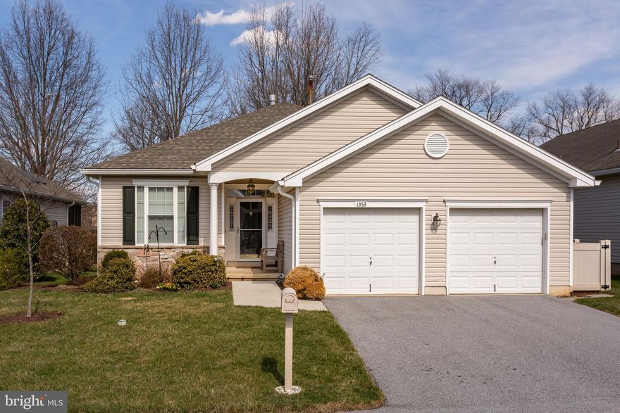 Welcome to 1353 Troon Lane, a beautifully updated Cedar model in the highly sought-after Hershey’s Mill 55+ community! This 2-bedroom, 2-bathroom home is a downsizer’s dream, offering a two-car attached garage, open-concept layout, a modern kitchen with stainless steel appliances, and a fully finished lower level. The location couldn’t be better: with a cul-de-sac setting, plenty of available guest parking, and breathtaking golf course views in the rear. Experience low-maintenance, blissful living with amenities that include a Community Center, library, pool, tennis courts, pickleball, wood shop, walking trails, and, of course, the nearby golf course and clubhouse. 
From the moment you step through the front door—framed by a transom window and sidelights—you’ll feel the airy, sunlit ambiance that flows throughout the home. The home’s open-concept floor plan ensures great flow from one room to the next, making entertaining seamless. The eat-in kitchen is both spacious and modern, with tumbled marble backsplash, sleek granite countertops, and stainless steel appliances. The family room and adjacent sunroom provide additional sun-drenched living space as well as access to the private deck, the perfect place to enjoy your view of the golf course. The primary bedroom includes a renovated en suite bathroom with ample cabinet and counter space. An additional bedroom and full hallway bathroom complete the main level of the home, ensuring plenty of space for friends and family. The lower level is a true standout– spacious and fully finished to include a great room, an office with built-in cabinets, and an additional bonus room to be used for whatever you need: space for guests, a home gym, additional living space, or storage. 1353 Troon Lane has been meticulously maintained and updated— with renovated bathrooms, new Brazilian Mahogany hardwood flooring on the main level, new carpet on the lower level, and an extended deck with new steps and an elegant cable railing— it is the perfect option for those who want to move right into their next home!
Hershey’s Mill is a highly sought-after 55+ community, pairing low-maintenance living with unbeatable amenities including a library, pool, tennis and pickleball courts, walking trails, and a woodshop. Membership at the well-regarded Hershey’s Mill Golf Club is also available with an added fee.