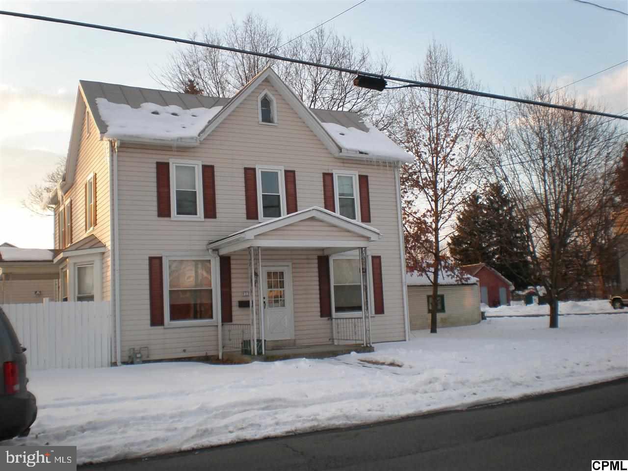 Large 2-Story with attached 2-car garage and workshop. Large fenced-in rear yard, electric heat-pump/central system, formal dining room, first floor laundry, gas hot water heater new in 2014, tin roof painted 2013 and much more. Pellet Stove in living room, refrigerator, electric range and hot tub to convey.