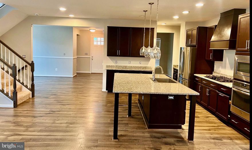 Welcome to 930 Forsythia Lane in the master-planned community of Embrey Mill. This corner-lot Miller & Smith home offers a thoughtful layout with both style and function. The gourmet kitchen features a wall oven, *oversized island, ample counter space, *gas cooktop, walk-in pantry, and more, perfect for everyday cooking and entertaining alike. The main floor also includes LVP flooring, a cozy *gas fireplace, a front study area/flex space, a dedicated dining space, and an open-concept living room with a second dining area. Just off the main living area, you'll appreciate the oversized garage and convenient mudroom drop zone. Upstairs, you'll find four generously sized bedrooms, including the owner's suite with walk-in closets and an ensuite bathroom. The upper level is completed by a dedicated laundry room and a shared hall bath. The finished lower level offers a great flex space that can serve as a media room, playroom, or hobby space, along with a full bathroom and ample storage. All of this is located in the highly sought-after Embrey Mill community, which offers two neighborhood pools, multiple playgrounds, dog parks, basketball courts, a community center, and scenic walking trails. Close to the new Embrey Mill Town Center, Publix, the Jeff Rouse Swim & Sports Center, Quantico, access to I-95, and the EZ Pass lanes for an easier commute. Schedule your tour today and see why so many people love calling Embrey Mill home.