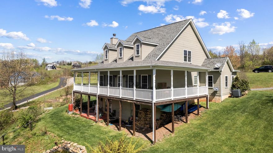 Nestled on a spacious 2 acre wooded lot, this custom built modern Farmhouse offers a harmonious blend of sophistication and comfort. As you step inside, you're greeted by hand-scraped Acacia Wood floors, built-in walnut bench, and a custom built fireplace mantle that lend a touch of rustic elegance to the interior. The main floor boasts bedrooms conveniently located for ease of living, along with a main floor laundry room for added convenience. The heart of the home lies in the inviting kitchen, where soapstone counters complement modern appliances, and custom light fixtures illuminate the island and dining areas. With plenty of windows flooding the space with natural light, the kitchen and living areas create an inviting space for gatherings and daily living. Upstairs, a versatile bonus family room awaits, perfect for use as a home office or game room, providing additional space for relaxation and entertainment. The partially finished basement offers flexibility and functionality, featuring a bedroom/bonus room, full bath, office space, and a painter/craft studio. An unfinished work space with a 220 amp circuit provides ample room for projects and storage, catering to various needs and hobbies. Outside, a wrap-around porch offers a charming spot to enjoy the surrounding natural beauty and provides space for outdoor dining and relaxation. A small water feature adds tranquility, while fenced raised beds and play equipment offer opportunities for outdoor enjoyment. Spring as sprung with an abundance of life with apple trees, perennial flower gardens, rhubarb, asparagus, gooseberry, blackberry, blueberry, and wineberries. Minutes from Fox Meadow Winery and the AT. With its thoughtful design, abundance of natural light, and attention to detail throughout, this modern farmhouse presents a rare opportunity to embrace modern living in a serene wooded setting.