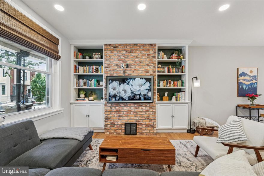 Welcome to 3116 Cedar Street—a beautifully renovated and spacious rowhome in the heart of booming Port Richmond! This 3-bedroom, 2-bath gem blends modern upgrades with timeless charm, featuring original hardwood floors, an exposed brick accent wall, and custom built-ins. The open layout flows into a stunning chef’s kitchen with stainless steel appliances, white shaker cabinets, quartz countertops, and a large dining area perfect for entertaining. A rare first-floor full bath includes slate tile and a glass-enclosed shower. Major upgrades include a new roof (2020), repointed front and rear brickwork, a paved rear yard with new vinyl privacy fencing, a new water heater (2018), central air and furnace installation, updated HVAC (2019), improved plumbing and electric, and roof attic insulation. The owner also added recessed lighting and updated fixtures throughout, bathroom ventilation fans in both bathrooms, and exterior security cameras for added comfort and peace of mind. Upstairs offers three spacious bedrooms with ceiling fans and ample closet space, along with a renovated hallway bath featuring classic subway tile. The refreshed basement provides additional storage and houses the laundry. Enjoy the private backyard or relax on the charming covered front porch. Located just minutes from neighborhood favorites like Gaul & Co. Malt House, Bonk’s Bar, La Roma Pizza, and Campbell Square, with easy access to I-95, the MFL train, and SEPTA routes—3116 Cedar Street checks every box for style, space, and location. Don’t miss it!