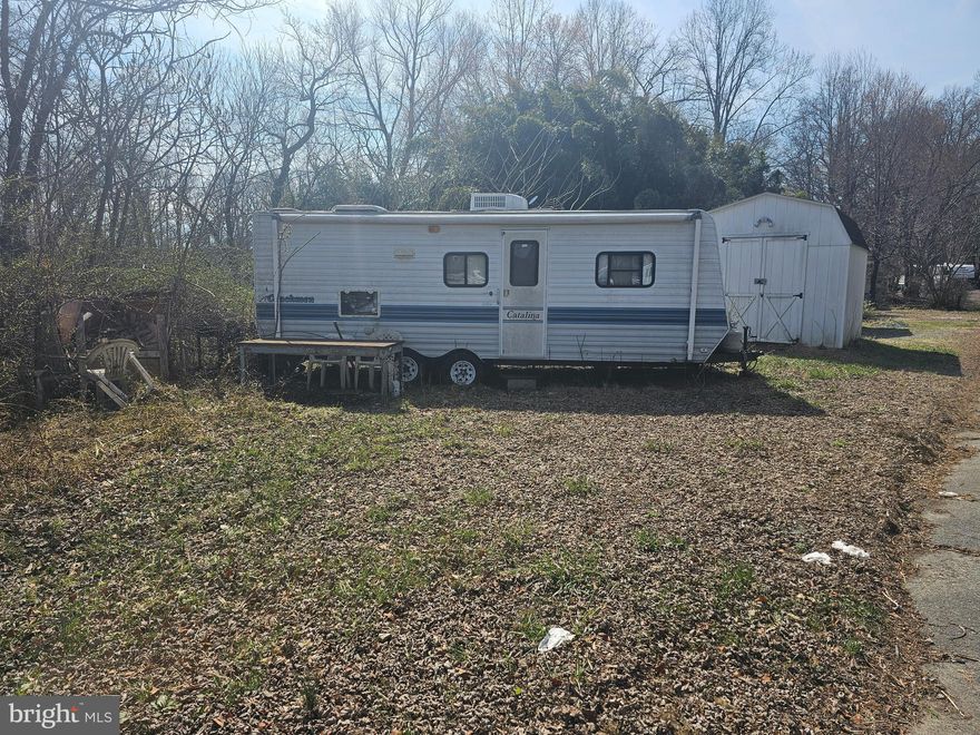 Two lots located in Indian Acres Campground (not a full time residence) with a camper and shed. Lots back to water.  So much to do in this Campground community with a boat ramp to the Sassafras/Chesapeake Bay, Pools, Convenience Store, Arcade, Activities and so much more. Come see what this gated community has to offer.