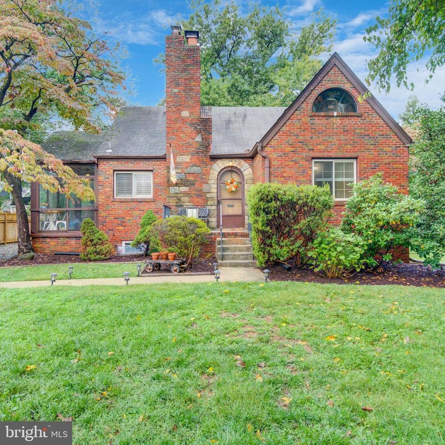 Welcome to this charming Tudor-style home in the popular Indian Spring Hills neighborhood of Silver Spring! This all-brick beauty has so much character.
As you step inside, you'll be greeted by a spacious living room featuring recessed lighting, lovely plantation shutters, ceiling fan, hardwood floors, and those classic arched doorways we all love. The wood-burning fireplace adds a cozy touch, making it the perfect spot for gatherings with friends and family.
The dining room is elegant and can comfortably fit eight people under a stylish chandelier. And if you enjoy your morning coffee or evening unwind, the all-season side porch is just the place, with sliding glass doors and lots of windows letting in the light.
The galley kitchen offers plenty of storage and easy access to a big, level backyard surrounded by mature landscaping. You’ll find two bedrooms on the main level that share a beautifully updated full bath.
Head upstairs to discover a spacious, private bedroom with exposed beams—such a nice retreat! The finished lower level is impressive too, with high ceilings, a second living room, half bath, and a fourth bedroom/den/office/home gym. Plus, there's a utility room with laundry and extra storage.
You’ll love the convenience of being inside the beltway with access to 495 on both sides of the neighborhood, just minutes to downtown Silver Spring, and Sligo Creek Park. And there’s off-street driveway parking for up to four cars AND an EV charger! Don’t miss out on the chance to make this wonderful home yours!