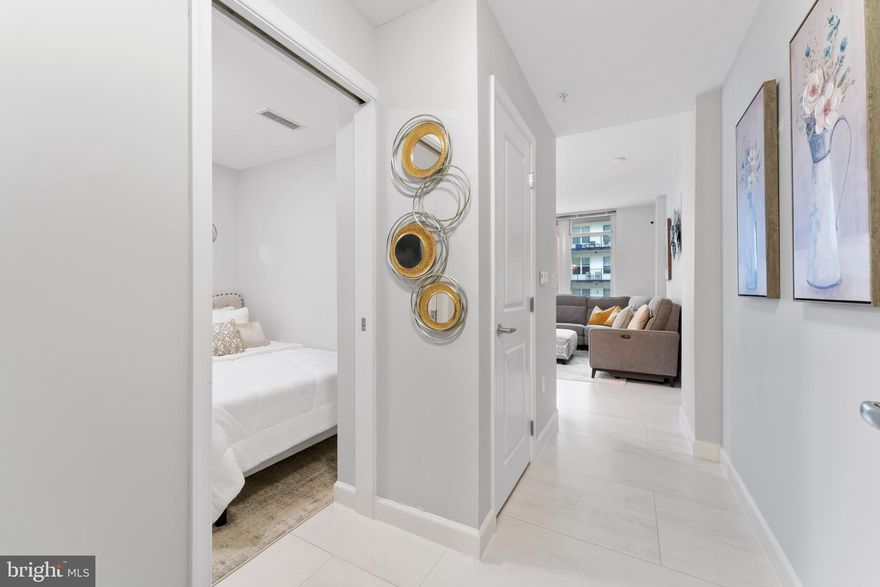 Welcome to this lovely fully furnished 1 Bedroom, 1 Bath plus Den residence with an open floor plan at sought after One National Harbor.  (The furniture can be moved if requested.) It boasts a generously sized primary bedroom with a large walk-in closet with a spacious full bath. The kitchen showcases stainless steel appliances and elegant countertops with washer and dryer. The versatile den doubles as a guest bedroom or a dedicated home office. Updated floors, new paint throughout, with an assigned parking space. It has a state of the art fitness facility, resident lounge w/billiards table and piano for your entertainment. This unparalleled beauty has amenity spaces including an outdoor rooftop pool with views from the observatory deck offering breathtaking panoramic views of the Potomac River and Nation's Capital. The management and concierge is on site for your convenience. Dining, shopping and entertainment is right outside. The building overlooks Old town Alexandria, DC, the Capital Wheel and the Woodrow Wilson Bridge. It is close to National Airport, Andrews Air Force Base, and Bolling Air Force Base. Close to 295/495 and 395.  Available for immediate move-in.