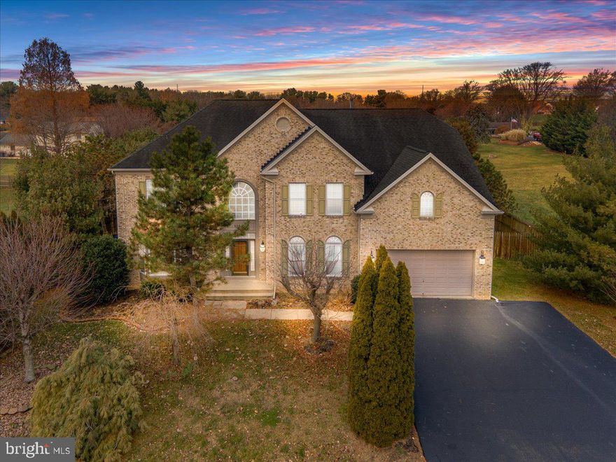 "The Balmoral" by NVR boasts 7,000 finished sq ft sitting on almost 1/2 acre lot. Walk into your spacious two story foyer with a stunning staircase & a palladian window for natural light. To your right you have your formal living room with wainscotting molding & a huge bay window. Main level private office with french doors. Two story family room with two story windows, gas fireplace and wainscotting molding. Kitchen with custom cabinets,  granite countertops, ceramic tile backsplash, crown molding, updated appliances & island with bar stool seating. Butler's pantry leads to a formal dining room. Sunroom bump out serves as a 2nd dining area for large gatherings. Owners bedroom suite with cathedral ceilings, sitting room & walk in closet. The owner's bathroom suite with a sit-in tub for two and separate shower. Bedrooms 2 & 3 are joined by a "jack & jill" bathroom. Bedroom 4 is on the right wing of the home sitting privately away from the first 3 bedrooms & has its own full bathrooms. Finished lower level with door to exit to the back yard and a 4th full bathroom. Every detail of this home has been tastefully put together by the current owners. Great location close to shopping, restaurants and major highways.