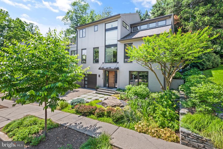 2 YEARS NEW!! ELEVATOR AND A POOL - IT'S NOW OPEN!
A once in a lifetime opportunity to own this expanded and newly renovated light-filled dream home in the heart of Woodley Park. This contemporary home checks every last box with its masterful design, exquisitely finished chef-grade kitchen, spa-like master suite, pool, elevator, and proximity to Metro. Five beautiful new bathrooms and wood floors adorn all three levels. Light fills the entire home through the new windows and skylights. The moment you walk through the mahogany front door, it is clear just how exceptional this home truly is. Whether you climb the floating staircases or take the elevator, each level delivers brilliant aesthetic design.


The spacious new chef's kitchen has soapstone counters, chef-grade appliances, an island, designer cabinets, and a banquette with storage.  There are pocket doors to conveniently close off this space if that is the hosts' wish while entertaining guests. There is a generous dining room that is flooded with natural light. Nearby there are large closets perfect for storage and a gorgeous powder room. The living room is open yet cozy with its gas fireplace and access to the backyard. There is a bedroom on this level, currently used as an office. It includes its own gorgeous en-suite bath. 


Another flight up the floating staircase you’ll find additional bedrooms. The owner's suite offers accommodations one would only expect while on vacation at a luxury resort.  There is a beautiful view of the lush green yard and the pool. There are two walk-in closets with automated lights, a private balcony, and a spa-like dream bathroom with a freestanding soaking tub, a large separate shower with bench, a double teak vanity, heated floors, and a private water closet. There are two more bedrooms on this level, both with fantastic storage and yet another spectacular bathroom.


The first floor includes a guest bedroom and a wonderful family room with a wet bar, a fireplace, and built-ins. The wonderfully designed level would make a fantastic in-law or au pair suite. It was purposely designed to accommodate an owner or guest with a disability.  The absolutely stunning bathroom is both sleek and modern, and yet designed with a curbless shower to allow access for someone who may be in a wheelchair. The layout makes the home a great option for a multigenerational family home. The elevator, the wine cellar, the laundry room, and the expanded garage are also on this level.


Modern amenities continue to surprise with built-in speakers on multiple levels, security, Lutron lighting, a tankless hot water heater, multizone energy efficient heating, and a heavy up that provides more than enough power to charge an automobile. The backyard is an entertainer's paradise, with gorgeous hardscape - perfect for gatherings, a built-in pool, and a private space for sunbathing.


Just blocks from Woodley Park Metro this home has it all right where you want to live. You are near beloved neighborhood restaurants, shops, The Maret School, Oyster-Adams Bilingual Elementary, The National Cathedral, and more.