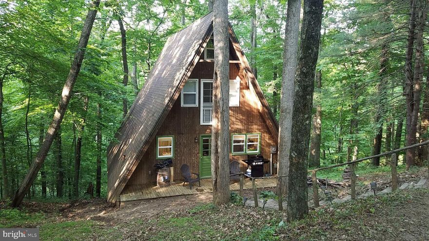 Sweet 2 br, 1 ba A Frame home privately situated in White Oak Lake Subdivision just outside of the town of Madison approximately 4 miles. Nice kitchen, big living room, bedrooms are upstairs, bath is on the main level with the laundry rm, kitchen and living room. Back deck overlooks the wide stream flowing into the huge Lake which is used for fishing, swimming, boating etc.  Come enjoy the quiet country living!