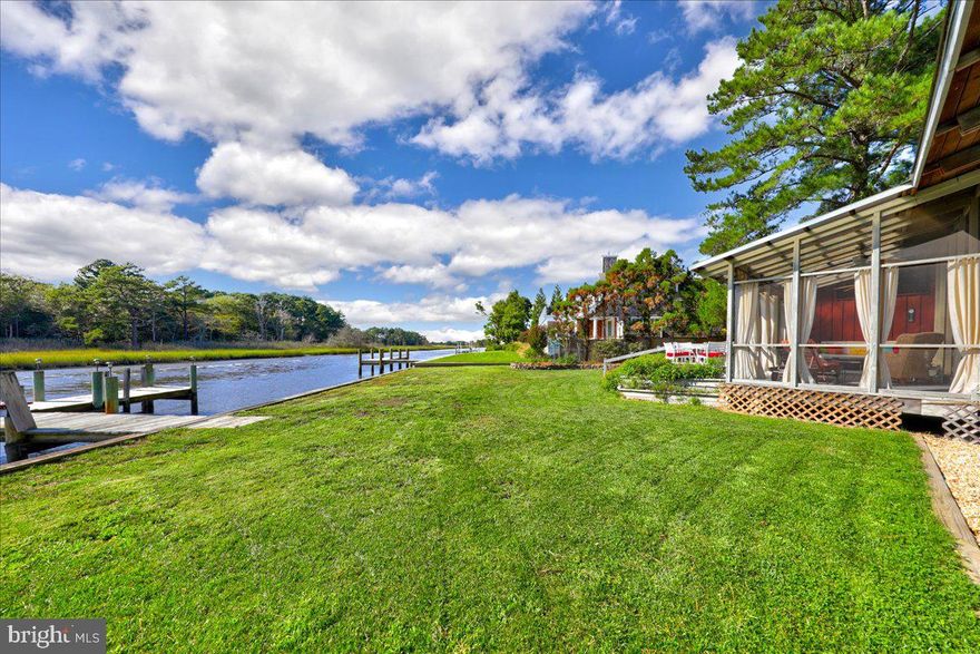 This is very likely the very first cottage built in North Shores (except for the model), which is probably why you'll be hard pressed to find a better lot with picturesque views from the entire rear of the home and across the Lewes-Rehoboth Canal. This mid-century modern home is like a time capsule of charm and built just off center to allow the eye to capture the best possible panoramic landscape It is nestled quietly amongst the pines in the prestigious community of North Shores. The Main House features original hardwood floors, built in seating, sliding glass doors from the living room and into the 2nd primary bedroom allowing you to soak in the amazing scenery no matter where you stand. The original master bedroom is off the front courtyard and offers its own respite. Two additional bedrooms are located in the casita across the breezeway with a full bath on the outer edge of the Main House. Entertain or relax on the jumbo-sized screened porch leading into the spacious back yard. Sit on your private dock or jump on your boat and ride to the Rehoboth or Delaware Bays and Atlantic Ocean. It is located just a short walk to Gordon's Pond and along the Breakwater & Junction Trail at Cape Henlopen State Park.  The community's private beach, swimming pool, tennis courts and other amenities are a stone's throw away.  The town and boardwalk of Rehoboth Beach are just around the corner along with the incredible restaurants and shops.