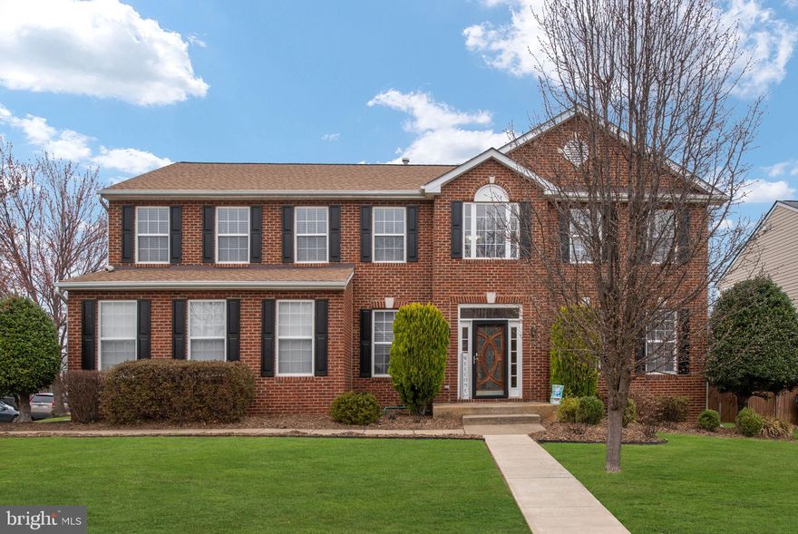 Gorgeous 5 bedroom 3 ½ bath Corner homesite colonial home in the coveted Somerset Landing neighborhood!  This three-story home is professionally landscaped with a huge, flat backyard, a massive Primary Ensuite with spectacular Custom Tile Bath including seperate walk-in shower and gorgeous soaking tub as well as a Walk-in Closet.  The main level boasts a Custom Gourmet Kitchen with new Stainless Steel appliances, upgraded Granite Countertops, beautiful custom oak cabinetry and a large center island.  The stove, dishwasher, microwave and fridge are all new (less than one year old) and upgraded.  This lovely home offers a  fully finished Walk-Up basement complete with a full Second Kitchen.  This brick front home has three large secondary bedrooms upstairs along with the Primary Ensuite and an updated tiled second bathroom with New Light Fixtures and Fresh Paint.  An inspiring oak staircase dominates the impressive 2-story entrance and leads into the open concept kitchen and main living space, complete with a working Gas Stone Fireplace and wooden mantle.   A Formal Dining Room with beautiful chair rail and den with a new sliding barn door complete the main level.   Fully renovated lower level includes the second kitchen, full bathroom, fifth bedroom (NTC), beautiful French doors leading into a Gym/Home Office and the Laundry Room with updated Washer and Dryer (which do convey).
The side entrance Two Car Garage, immaculate Front Lawn, Large Deck with upgraded railings and in-ground Sprinkler System create massive curb appeal plus wonderful outdoor living and/or entertaining  ability!  Property is within five minutes of the local Elementary and Middle School and was just re-zoned for the Colonial Forge High School for 2026.  Home is freshly painted throughout, has brand new light fixtures in the bathrooms and dining room, has a backyard shed, swing set and sits in a quiet, friendly neighborhood with playgrounds, a tennis court and a walking path.  Seller is open to assisting you with your closing costs for full price offers.