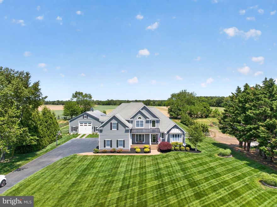 Properties like 29 Bridle Ridge Circle don’t come along often! This extraordinary 5,642-square-foot home features 4 bedrooms, 3 full and 2 half bathrooms, a thoughtfully designed floor plan, and curb appeal straight from a magazine. Custom millwork graces every room in this home, including on the ceilings! The fully redesigned kitchen is the heart of the home, updated just a few years ago with the finishes and function you’ll fall in love with. Featuring updated millwork, white cabinets, custom tile backsplash, a large center island with storage and seating, and stainless steel appliances, this kitchen was designed for cooking and entertaining. A separate bar with storage and a wine fridge gives you even more space. Just off the kitchen, you’ll find a well-equipped laundry room with beautiful glass doors, tile backsplash, and loads of counter and cabinet space. Next to the laundry room is a spacious pantry with double doors. The kitchen opens into a large living space with an eye-catching fireplace surrounded by wooden accents and built-in storage. A wall of windows makes the space feel open, bright, and sunny. Just off the kitchen is a large sunroom with beautiful windows overlooking the backyard. A spacious sun porch with brick flooring and custom removable windows provides the perfect place to relax or entertain. The sun porch opens to your very own backyard oasis with an in-ground Anthony Sylvan concrete pool and a cabana pool house with a full bathroom. You’ll feel like you’re on vacation every day! Back inside the home, you’ll find a luxurious primary suite that feels like a relaxing escape, complete with a geothermal unit for comfort and a spa-worthy bathroom with heated marble floors, a stand-alone tub, and a walk-in tiled shower with multiple shower heads and a tile bench. Redesigned just three years ago, every morning here feels like a retreat! Three-zone geothermal units allow everyone to relax at their own comfort level. On the second floor, you’ll find 3 more beautifully-appointed bedrooms, complete with custom millwork and large windows, and 2 updated bathrooms. A bonus room, attic, and loft overlooking the living space complete this luxurious second floor. The fully finished lower level is a basement truly built for living! Here you’ll find a dedicated home gym, a half-bath, a conditioned mechanical room, and multiple storage spaces to keep everything organized and accessible. The home also features a 1,700-square-foot, finished and heated barn, ideal for a workshop, studio, entertainment space, home office, or hobby haven – whatever your heart desires! Nestled in the popular Lewes community of the Estates at Bridge Ridge, this unbelievable home offers the perfect blend of peaceful living with coastal access. Just minutes from Route 1 shopping and dining, Lewes Beach, Cape Henlopen State Park, and downtown Rehoboth Beach, it’s luxurious living at its finest. Whether you’re looking for a full-time residence or the ultimate Sussex County beach retreat, 29 Bridle Ridge Circle delivers on every level. If you’ve been waiting for something extraordinary, this very well could be the one. Schedule your private showing of this remarkable property today!