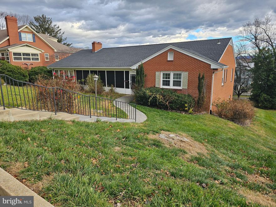 Welcome to this truly unique and versatile 4 bed, 2.5 bath residence, perfectly situated in a desirable in-town location. This spacious home is designed for modern living, offering flexibility for a large family, multi-generational living or those who love to entertain in style.  This home has two full kitchens each located on a separate floor. Dual kitchens are a rare find! Perfect for in-law suite potential, large scale entertaining or catering to different culinary styles. All season sunroom: a bright space for morning coffee or relaxing year round. Two cozy fireplaces: Enjoy the warmth and ambiance with fireplaces on both the main level living as well as the basement. Seamless garage access: Enjoy the convenience and security of direct access from the attached garage. This home has walkable access to local amenities, parks and dining.