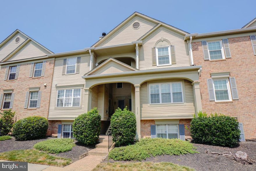 Water Views! Move in ready 2BR/2BA condo in the Bull Run community with tons of amenities and convenient for transportation! Rarely available, first floor unit with incredible natural light and beautiful views of the community pond. Open concept floor plan with vinyl flooring for easy clean up, a large kitchen with updated stainless steel appliances and ample counter top and cabinet space with room for a breakfast table! Walk-out to the rear patio and enjoy those views or cozy up in the family room with a woodburning fireplace! Two sizable bedrooms, both with large walk-in closets and private ensuite full bathrooms! This unit has been freshly painted throughout, new carpeting installed, a brand new hot water heater and more! Full size washer and dryer in the convenient laundry room with shelving and new flooring as well! This unit also includes  two parking passes and one additional visitor pass as well as access to the Bull Run Swim & Racquet Club featuring pools, tennis courts, tot lots, basketball courts & more!