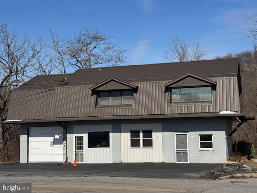 Business Opportunity- One of a kind property in McVeytown, offers garage plus workshop/storage on the 1st floor and 2 bedroom residence on the 2nd floor. Residence offers spacious kitchen/living room area, 2 bdrms, bath, laundry room & large storage area with attic access. Heated with oil, hot water baseboard and features central air, wide hallways & doors and large rear deck overlooking wooded area and stream.  Subject has 2, 200 amp 3 phase 240V electric services.  Currently, used as a 1 garage and office space, storage and 1/2 bath.  However, interior walls can be removed to expose 2 more garage bays.  Overhead doors are still intact.