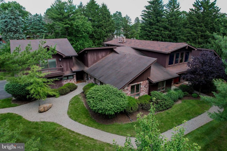 Lehigh Parkway is known for it's mature tree lined streets featuring old and new styles where no home is the same. This contemporary home sits on 1.45 acres of beautifully landscaped land. Be showered w/ natural light as you enter the split staircase foyer featuring marble floors that extend throughout the majority of the house. Upstairs you will find an expansive room perfect for entertaining as it opens to the balcony providing views of the pool and landscaped backyard. Three BRs and 2 full BA are set off to the right wing of the house, each w/ oak hardwood floor and ample closet space. Primary BR features a large sitting area w/ built-in cabinets. As you move towards the right wing of the home you will pass by the generously sized sunken family room w/ sliding glass doors that extend to the outside stone patio area. Dining room, living room and kitchen all bright, open and airy make up the left wing. The Poggenpohl kitchen has granite countertops, SS appliances and an oversized island perfect for gathering. Guest suite completes the left wing, w/ two BRs, full BR, family room and private balcony. Lower level helps to complete all your needs w/ a full bar, Rec room, 2 Brs, BR, additional closets and rooms and ample storage. In-ground pool just changed over to saltwater completes this home. The Lehigh Parkway offers privacy with convenience and this home will not disappoint.