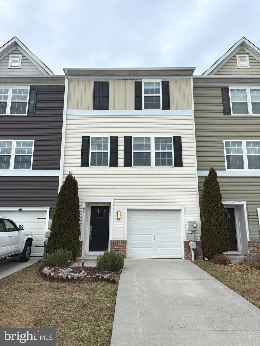 Welcome home to this well-maintained and recently updated 3-bedroom, 2.5-bath townhome in the desirable Berkeley Ridge community of Martinsburg. The first-floor bonus room with a half bath provides flexible use as a home office, guest space, or recreation area—ideal for today’s work-from-home needs.

The open-concept main level features new flooring throughout, a bright living area, and a modern kitchen with stainless steel appliances, a breakfast bar, ample cabinet space, and a new dishwasher. Upstairs, the primary suite offers a walk-in closet and private bath, while two additional bedrooms share a full hall bath.

The home includes new washer and dryer. A finished lower level with walk-out access leading directly to the community playground, offering convenient outdoor access with minimum yard maintenance. An attached one-car garage and driveway parking provide added convenience.

Ideally located near I-81, shopping, dining, and medical facilities, and schools, this property offers an easy commute and access to everyday essentials. Available for immediate occupancy.