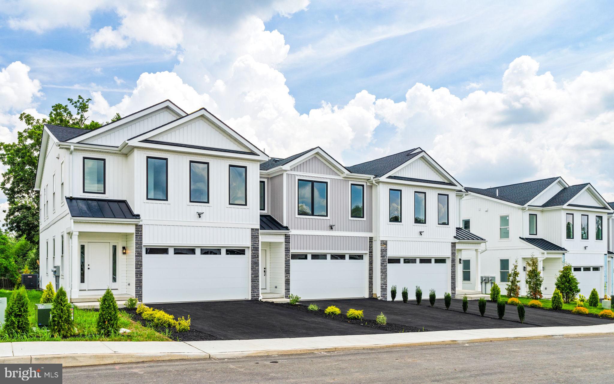 Introducing the Hawthorne model at Forest Park at Southampton. Timeless design meets modern functionality in this thoughtfully crafted 3-bedroom, 2.5-bath townhome—offering 1,864 square feet of refined living space in Lower Bucks County’s most anticipated new community. Set within Forest Park at Southampton, an intimate enclave of just 30 boutique farmhouse style townhomes, this residence features a 2-car garage and an architecturally striking exterior defined by black-framed oversized windows, clean vertical lines, natural stone accents and a mix of contemporary textures. Inside, the home is equally impressive—blending open-concept design with upscale finishes and quality construction. The main level boasts 9-foot ceilings, wall-to-wall hardwood flooring, and an abundance of natural light. A chef’s kitchen anchors the space with custom 42" cabinetry, an oversized center island, sleek matte black and premium stainless steel appliances. The open flow into the living and dining areas offers an ideal layout for both entertaining and everyday living, with optional Trex decking providing a seamless indoor-outdoor experience. Upstairs, the primary suite offers a serene retreat, complete with a spa-like bath featuring a freestanding soaking tub, frameless glass shower, double vanities, and modern matte black hardware. Two generously sized secondary bedrooms, a full bath with another double vanity and a loft space complete the upstairs area. Standard features across every home at Forest Park include oversized windows, lever-style door handles, minimum 9-foot ceilings, and thoughtfully curated designer touches throughout. Buyers also have the option to add a finished basement for expanded living space.
Beyond the homes themselves, residents will enjoy access to a private community walking trail, perfect for morning jogs, evening strolls, or a quiet moment in nature. The Hawthorne offers a rare opportunity to own new construction in a design-forward, low-maintenance setting just minutes from major roadways, shopping, and dining—where modern style and suburban ease come together seamlessly.