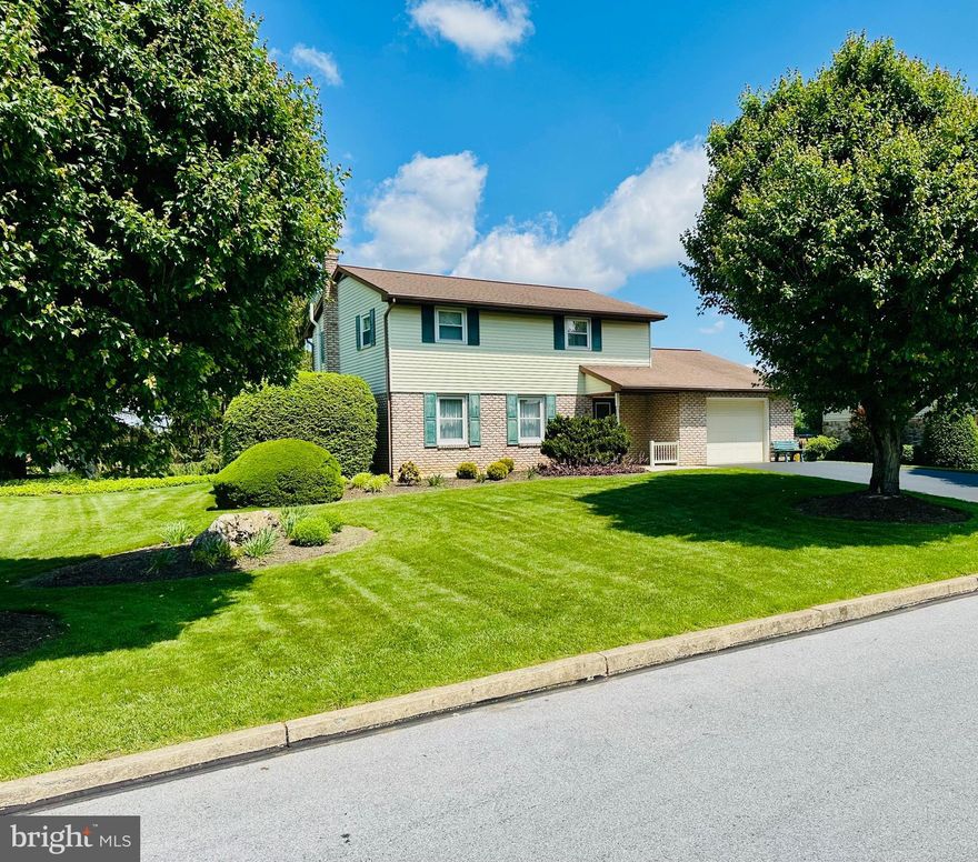 This well-maintained updated home situated on a beautifully landscaped large lot is awaiting its new owner(s). The road is a dead end on both sides which can make for a quieter neighborhood.  Walk into the welcoming foyer and see that the entire first floor has beautiful wood flooring. The large living room has a propane fireplace to keep you cozy in the cold evenings.  There is a private dining room and a large eat-in kitchen that is open to the family room.  Hallway from family room brings you to a full bath, laundry area and the large rear screened porch which is perfect for sitting and enjoying the view. It leads to an even larger deck for your grilling pleasure.   The wide second floor stairway is accessed from the foyer.  Primary Bedroom was originally 2 bedrooms but is now a very large main bedroom with 3 closets.  2 more nice sized bedrooms and a full bath complete the second-floor floor plan. Stairway to basement is off kitchen and leads to a finished/heated rec room and then an unfinished storage area.  The farmland that abuts the backyard is a preserved farmland and a walk through that area will lead to an opening to the rails to trails.