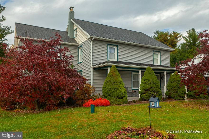 NEW LOW PRICE!  Lovely, detached, 4-bedroom, 3.5-bathroom, c. 1947 Colonial with wood floors throughout on a .73-acre, deep lot with lovely landscaping, trees, and huge back yard that extends to the rear fence.  Enjoy lounging on the large, covered front porch with porcelain tile floor.  The main level bedroom suite features a full bathroom, plus the second level bedroom suite, which also has its own bathroom, should accommodate your household needs.  2005 renovations ($160,000) included the roof, plumbing, 400-amp electrical, insulated vinyl siding over concrete block, tilt-in thermal pane windows, two heat pumps, bathrooms, and kitchen.  The oversized 2-car garage, built in 2017, has automatic doors, remotes, a 220 outlet, concrete floor, and side door to a concrete block patio.  Ample additional parking on the concrete driveway, and approximately half of the gravel driveway adjacent.  In the rear, are an old shed with two entrances, and a large, c. 2009 shed.  Conveniently located close to Williamsport, Hagerstown, Sharpsburg, Antietam Battlefield, the Potomac River, Shepherdstown, Harpers Ferry, Martinsburg, and much more.