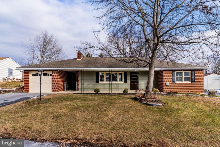 Welcome home to this beautifully renovated brick ranch home in North Middleton Township and Carlisle Area School District.  From the moment you arrive, you're greeted by a showstopping front door and timeless masonry curb appeal. Inside, the home features gorgeous refinished hardwood floors, fresh neutral paint, updated trim, and recessed lighting throughout, creating a bright and inviting atmosphere. The main level offers three bedrooms and two fully remodeled bathrooms, thoughtfully updated with modern finishes and fixtures. The fenced rear yard is perfect for relaxing or entertaining, complete with a paver patio for outdoor gatherings. The full basement expands your living space with a large finished recreational room featuring a bar and new flooring. Move-in ready and packed with upgrades.  Come check this one out.