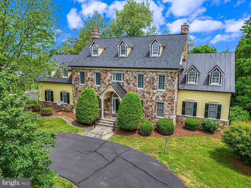 Welcome to a stunning countryside estate in the heart of Round Hill, VA, where scenic landscapes and equestrian properties abound. As you approach this incredible home through its winding entrance, you're greeted by a stately appearance, mature trees, and a grand circular driveway. The property boasts 10 gentle acres, a carriage house, a large covered patio and an inviting in-ground pool, perfect for relaxing and entertaining.

This elegant home features 4 spacious bedrooms and 4.5 baths in the main house, each bedroom with its own en-suite bath, offering comfort and privacy for all. The huge primary suite is a retreat in itself, complete with a gas fireplace, sitting room, and generous closets. The large formal living and dining rooms exude sophistication, while the open eat-in kitchen and family room create a warm and inviting atmosphere. The family room, with its wood coffered ceilings and a cozy wood-burning fireplace, is the heart of the home. 

While the kitchen and baths retain their original charm, and the large unfinished basement presents an opportunity for customization, the home’s superior setting and remarkable features make it an absolute stand out. In 2023, over $160,000 was invested in replacing the roofs, gutters, and gutter guards, ensuring peace of mind and enhancing the home's durability and appeal. The stone front, Hardie plank siding, and standing seam roofs add to the home's timeless elegance.

The property includes a carriage house with a two-car garage and a finished apartment above, providing additional living space and versatility. This apartment is perfect for guests or an au-pair, featuring a full bath and a comfortable living area.

Imagine waking up to breathtaking winter mountain views or spending your summer mornings enjoying coffee on the patio, listening to the serene sounds of nature and horses. 

Having enjoyed many occasions here as a guest, it is a privilege to offer this stunning home for sale. It’s a rare opportunity to own a piece of Round Hill’s scenic beauty and tranquility.