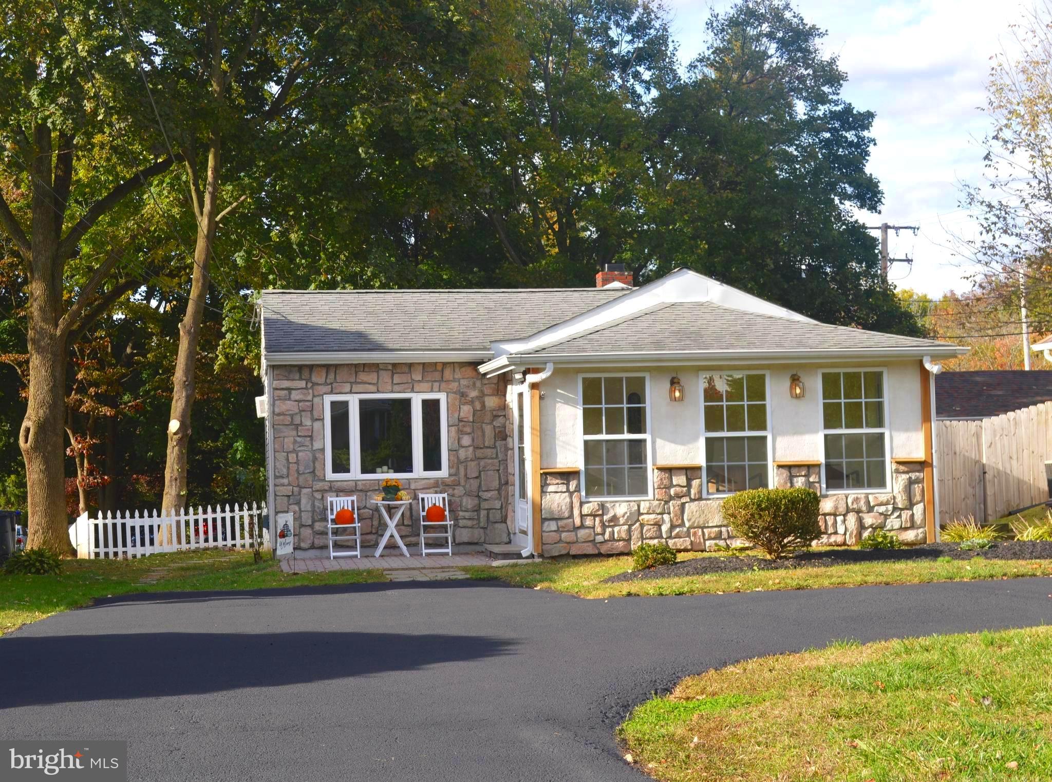 Picture Perfect! Make a private appointment to view this beautiful and charming expanded Ranch/Cottage located in Boothwyn. This home is move in ready and has so much to offer. One floor living at its best , plenty of curb appeal with the patio a sweet spot to relax with your morning coffee.The home offers new landscaping, fenced yard, a deep 50 x 200 lot. Pretty stone front/vinyl siding exterior, freshly painted, a heated sun/mud room with window surround and wood flooring, 128 sq ft enclosed and heated. The wide and spacious entry foyer is very inviting and can also be a nice office area. The living room and dining area is bright and sunny flooding with natural sunlight from the oversized windows, cathedral ceiling with exposed beams, tile and new carpet. The rear expansion, 264 sq ft, offers a gorgeous kitchen with ample wood cabinetry, electric cooktop range, tile backsplash and floor, recessed lighting, ceiling fan, built in microwave, dishwasher, refrigerator included. The laundry room-washer and dryer included, pantry, utility closet and rear exit into the huge fenced rear yard with mature trees, hosre shoe pit and a nice size storage shed. This large yard is another great space to gather with family and friends. The sunny main bedroom has two closets, the second bedroom offers a double closet, both with ceiling fans. The large bathroom has a classic black and white tile floor with white subway tile surround. Great location close drive to shopping,train, Original house has carwal space, rear addition has a crawl space, spacious shed with attic able to hold lots of storage. DE, I-95 to Philadelphia International Airport. Dont miss the chance to tour this amazing home before it's gone!
