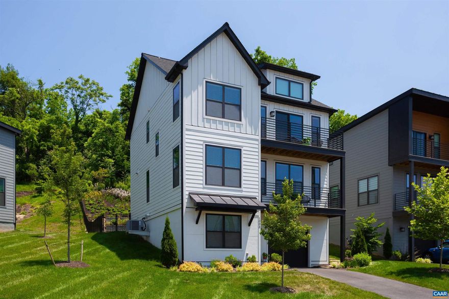 Fabulous home in Belmont with views of Monticello Mtn & close to several parks & the Rivanna Trail. This 4 bedroom, 3.5 bath has quality upgrades throughout the entire home. Backyard is fenced-in & terraced with hardscape & hundreds of naturalized plantings. Covered back porch offers a great place to relax and enjoy the views. Relax in the hot tub (conveys) & the balconies off of second and third levels. Every closet in this home has been customized by Closet Factory including the coat closet & Pantry. Kitchen has solid Maple Cabinets with glass fronts, interior lighting, pull out shelves, Granite counters, Tile backsplash, Refrigerator, Dishwasher, Wall-Oven & Convection/Microwave. Ceramic tile in all bathrooms. Hardwood floors throughout (no carpet). Solar Panels. Average Electric bill in summer is $0. Winter averages $70 a month. Gas, water and sewer average $120 a month. Spacious 1 car garage.,Glass Front Cabinets,Granite Counter,Maple Cabinets,Fireplace in Family Room