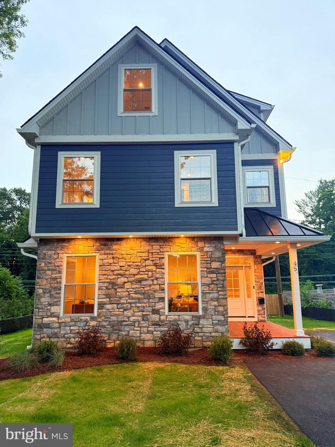 You know the feeling — when you step into a space and immediately feel like it was made for you. That’s exactly what happens the moment you arrive at 45 Orchard Lane in Berwyn. Tucked away on a quiet, tree-lined street in the prestigious Tredyffrin-Easttown School District, this brand-new custom home is everything you’ve been dreaming of — and more. The exterior immediately sets the tone with its modern charm: James Hardie siding, a sleek standing seam metal roof, and Andersen doors welcome you in with elegance and strength. The EP Henry patio and TimberTech front porch practically beg for cozy morning coffee or wine with friends at golden hour. The professionally landscaped yard is already done — no weekend projects required — and the five-car driveway ensures there’s room for everyone. But step inside, and it’s the heart of the home that captures yours. The kitchen is a showstopper. Designed with intention, it features Makellos custom cabinetry, stunning quartz countertops, a designer tile backsplash, and top-tier GE Profile appliances. Whether you’re preparing a holiday meal or unpacking takeout, this kitchen makes it feel special. The open-concept layout flows effortlessly — perfect for entertaining, yet grounded in warmth and comfort for everyday living. With five spacious bedrooms, there’s room for everyone — and for everything. Three full bathrooms and two beautifully finished powder rooms mean no more waiting for a turn. Each bathroom is custom-tiled with gorgeous finishes, including glass-enclosed showers and custom vanities that feel more boutique hotel than builder-grade. The white oak engineered hardwood floors add sophistication and warmth throughout the main level, while downstairs, the fully finished basement offers space for a home gym, playroom, media lounge, or whatever your heart desires — all with durable LVP flooring. Every detail has been thought through: dual-zone high-efficiency HVAC systems, instant hot tankless water heater, 200-amp service plus a 100-amp subpanel, and a second-floor laundry room right where you need it. But what you’ll love most is how this home feels: spacious but not cold, luxurious but livable, modern but timeless. It’s not just a house — it’s a place where memories are made. A place where you can settle in, breathe deep, and say, “This is home.” If you’ve been waiting for the one, this is it. Schedule your private showing today and fall in love with everything 45 Orchard Lane has to offer.