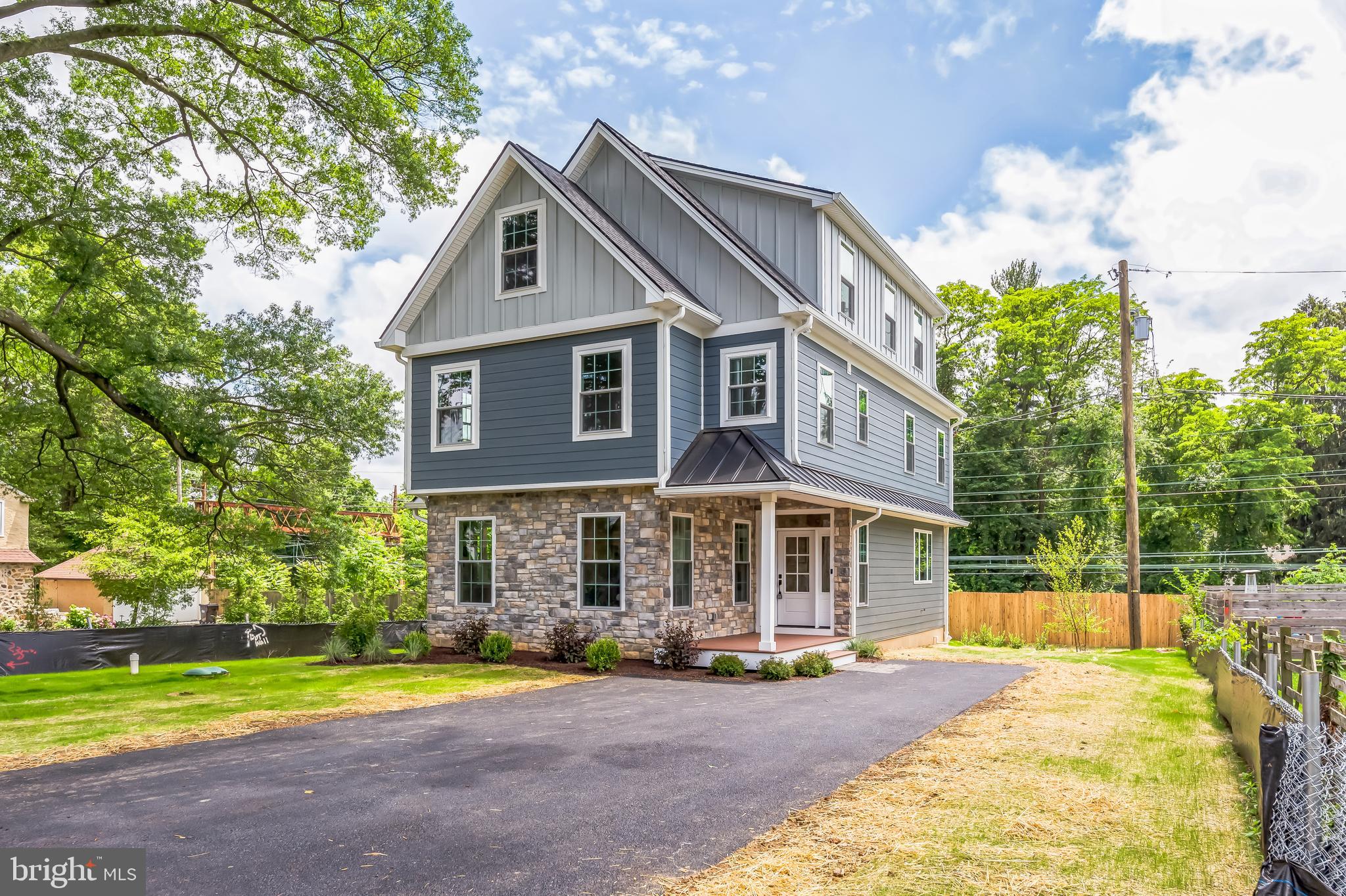 You know the feeling — when you step into a space and immediately feel like it was made for you. That’s exactly what happens the moment you arrive at 45 Orchard Lane in Berwyn. Tucked away on a quiet, tree-lined street in the prestigious Tredyffrin-Easttown School District, this brand-new custom home is everything you’ve been dreaming of — and more. The exterior immediately sets the tone with its modern charm: James Hardie siding, a sleek standing seam metal roof, and Andersen doors welcome you in with elegance and strength. The EP Henry patio and TimberTech front porch practically beg for cozy morning coffee or wine with friends at golden hour. The professionally landscaped yard is already done — no weekend projects required — and the five-car driveway ensures there’s room for everyone. But step inside, and it’s the heart of the home that captures yours. The kitchen is a showstopper. Designed with intention, it features Makellos custom cabinetry, stunning quartz countertops, a designer tile backsplash, and top-tier GE Profile appliances. Whether you’re preparing a holiday meal or unpacking takeout, this kitchen makes it feel special. The open-concept layout flows effortlessly — perfect for entertaining, yet grounded in warmth and comfort for everyday living. With five spacious bedrooms, there’s room for everyone — and for everything. Three full bathrooms and two beautifully finished powder rooms mean no more waiting for a turn. Each bathroom is custom-tiled with gorgeous finishes, including glass-enclosed showers and custom vanities that feel more boutique hotel than builder-grade. The white oak engineered hardwood floors add sophistication and warmth throughout the main level, while downstairs, the fully finished basement offers space for a home gym, playroom, media lounge, or whatever your heart desires — all with durable LVP flooring. Every detail has been thought through: dual-zone high-efficiency HVAC systems, instant hot tankless water heater, 200-amp service plus a 100-amp subpanel, and a second-floor laundry room right where you need it. But what you’ll love most is how this home feels: spacious but not cold, luxurious but livable, modern but timeless. It’s not just a house — it’s a place where memories are made. A place where you can settle in, breathe deep, and say, “This is home.” If you’ve been waiting for the one, this is it. Schedule your private showing today and fall in love with everything 45 Orchard Lane has to offer.