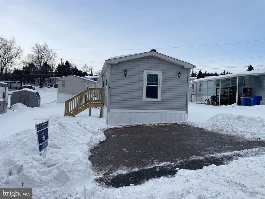 Discover this renovated, move-in-ready Conewago Township home cleared of snow and situated in up-and-coming Meadow Run Mobile Home Park with low ground rent. This residence boasts new interior and exterior paint, stylish light fixtures, and sturdy new outdoor steps. If you need a wheelchair ramp to enter the home, the seller will be glad to install one before closing at no extra cost. The kitchen features a brand-new refrigerator and gas stove, a one-year-old dishwasher, and a like-new washer and dryer. Enjoy the cozy fireplace insert and built-in sound system, or unwind in the primary suite’s bathroom, complete with a large garden tub and stand-up shower. New propane tanks with no lease payments as long as you buy the propane from provider. In proximity to local shopping and dining add to the home’s incredible appeal.
For local entertainment visit Gifford Pinchot State Park for lakeside recreation, Roundtop Mountain Resort for year-round mountain adventures, or the historic Central Market York for a taste of local culture. This stylish home offers the perfect balance of modern upgrades, affordability, and a prime location for hosting family and friends.