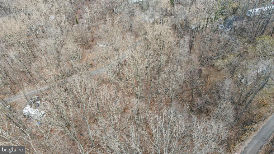 Private wooded lots, with road frontage, located on Woodpecker Lane in Harpers Ferry.  The property provides privacy while maintaining proximity to nearby homes, increasing the likelihood of utility connections.  No wetlands, no flood zone.  Conveniently located near commuter routes, shopping and outdoor destinations.  This parcel is ideal for future homesite, recreational use or long-term investment in a quiet mountain setting.