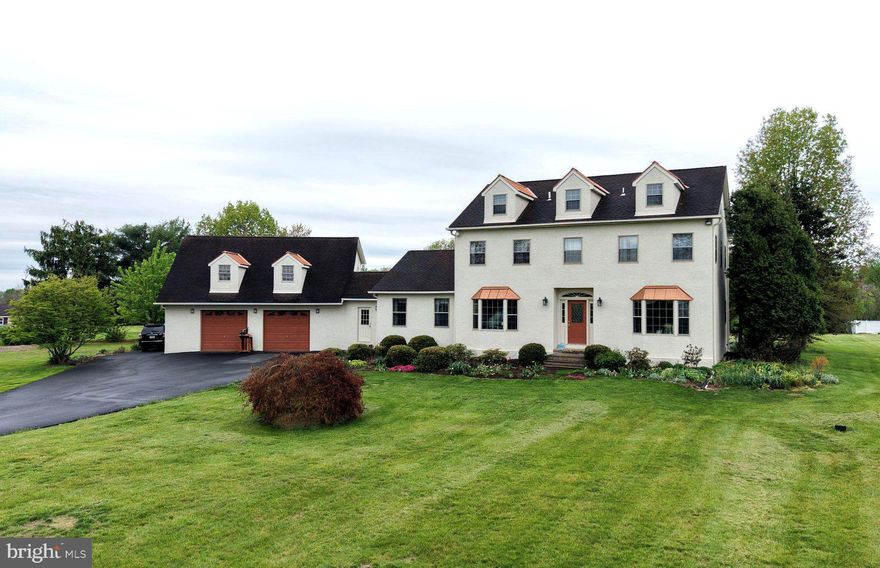 Situated within the scenic landscapes of Upper Salford Township, the stately Colonial at 800 Diminjan Lane offers approximately 3,288 square feet of refined living space. The interior boasts a flexible 11-room layout, including four bedrooms with the potential for two rooms on the third floor. This property benefits from a premier location within the highly-regarded Souderton Area School District and is tucked away on a quiet 1.55-acre cul-de-sac, just minutes from the Perkiomen Trail, the Pennsylvania Turnpike, and the boutique charm of Harleysville and Skippack.

Beyond its enviable location, this home is a masterpiece of eco-efficiency and high-performance infrastructure. It features a sophisticated Geothermal HVAC system, harnessing the earth's natural temperature to provide ultra-efficient heating and cooling with a significantly reduced carbon footprint and lower utility costs. The exterior has been meticulously maintained for longevity, featuring Rhino Shield—a flexible, waterproof ceramic elastomeric coating on the stucco backed by a 25-year warranty—and a premium 50-year architectural shingle roof. With a 200 AMP electrical service and a reliable 180-foot deep well, the structural integrity is as impressive as the classic aesthetic.

Exterior highlights include elegant copper-toned window awnings, classic dormers, and a sweeping driveway leading to an oversized 864-square-foot garage. This expansive space provides ample room for vehicles and storage, with an additional 680 square feet of unfinished space above offering endless potential.