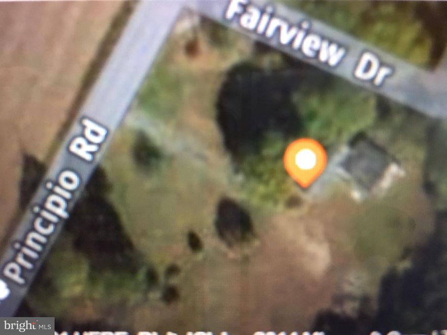 2+ country  acres overlooking pond and farmland. Existing singlewide mobile home can be replaced with singlewide or doublewide manufactured housing or a stick built home. Well, septic, electric, and paved drive in place. After turning in the drive, turn and look at  the pond across the county road and the multiple farms beyond. It is a peaceful pastoral view.  Easy access to I 95, Route 40, or Route 1.  Don't miss it.