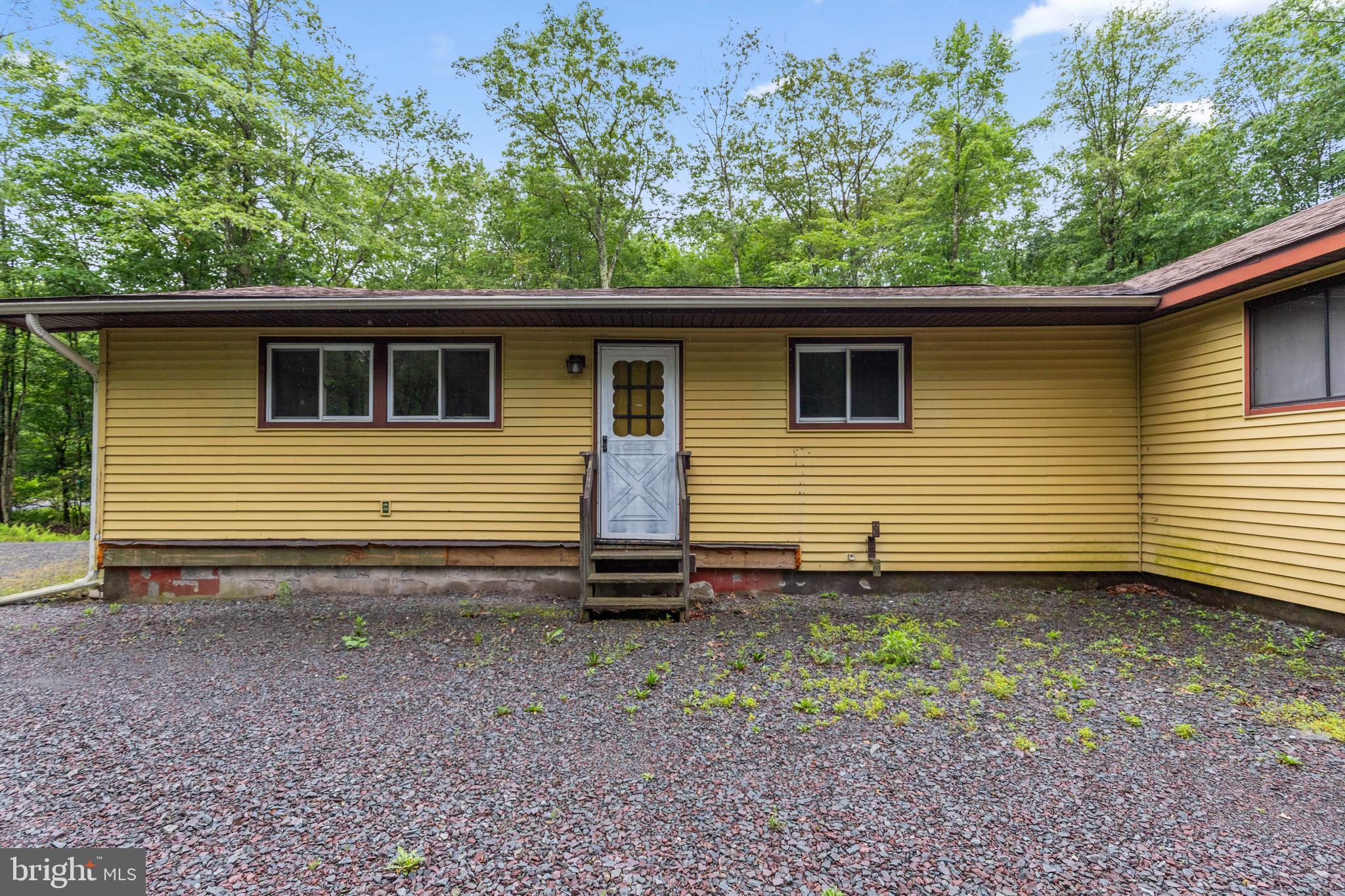 Welcome to 197 Wagner Way in Pocono Lake, PA! This charming 3-bedroom, 1-bathroom rancher sits on a spacious corner lot, offering plenty of room for parking with a driveway and a garage that provides additional storage and convenient access directly from the house. Looking for more space, option to buy the lot next door. Inside, you'll enjoy a modern look with beautiful floors in each room of the house, in the kitchen, black cabinets with ample space for storage, and a laundry room with countertops and extra space. The community offers stocked lakes for fishing and recreation, and ATVs and UTVs are allowed. Plus, you’re just 15 minutes from Jack Frost Big Boulder and Kalahari Water Park—great for family fun. This home is the perfect spot to enjoy the best of the Poconos!