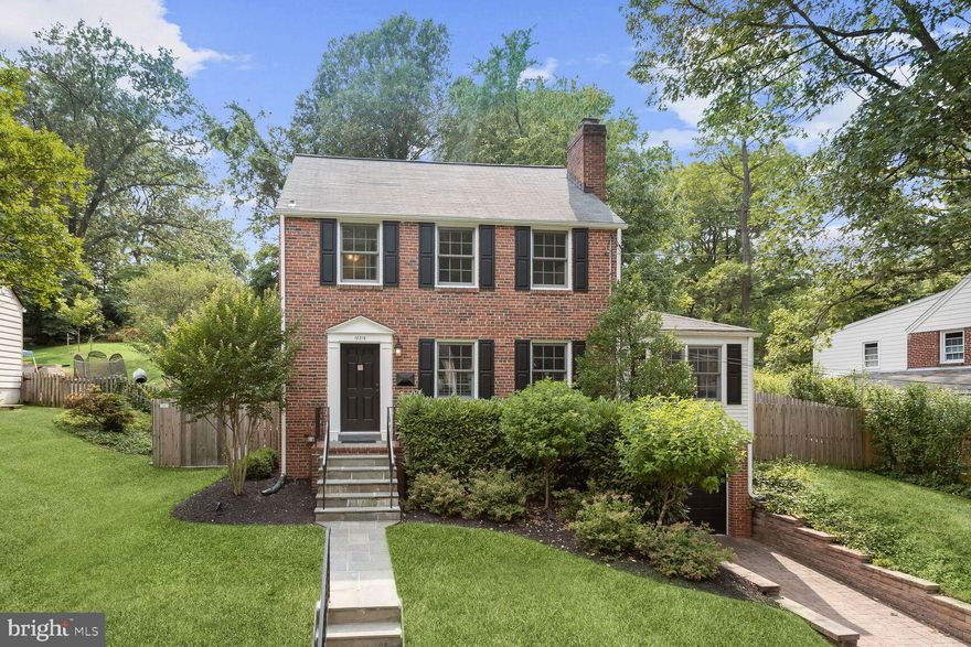 Beautiful colonial settled in the Woodmoor community of Silver Spring! Arrive on the main level and experience a sprawling living room adorned with a neutral color palette that highlights the crown molding, the brick surround wood burning fireplace, a built-in bookcase, and plantation shutters.  Take part in gourmet meals in the stunning dining room offering a custom built-in buffet with a beverage cooler and open shelving that allows for many entertaining options.  Let the kitchen inspire your inner chef boasting stainless steel appliances, custom window treatments, open shelving, subway tile backsplash, and butcher block counters.  The sunroom is ideal for a playroom or a den featuring laminate floors, a chair railing with beadboard wainscoting, and access to the pristine deck, patio, play area, and stunning hardscape. Enter through french doors to the private office suite or a main-level bedroom suite. Relax and unwind in any of the three upper-level spacious bedrooms adorned with natural light and offering board and batten accents and gorgeous hardwood floors.  The lower level awaits your inspiration and the possibility of a fitness area and provides access to the one-car garage.  Major commuter routes include Colesville Rd, MD-193, and I-495. Outdoor adventures await in Pinecrest Park,  Woodmoor Tennis Club, Montgomery Blair Baseball Stadium, and Indian Spring Terrace Local Park.