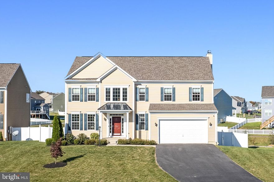 Built in 2018, this magnificent, like-new residence is 100% ready for you to move in and call it home! The well-appointed Aspen Greens community is ideally situated on the north end of Charles Town with quick access to Rt. 9 and Rt. 340, making a Maryland or Virginia commute a breeze. A brand new front portico, refreshed landscaping, and a 2-story foyer welcome you into this 3,100 sq. ft. Oakdale II floor plan that shows like a model home. The gourmet kitchen, ideal for culinary pursuits and entertaining, is enhanced with an oversized 12 ft. island, pantry with custom shelving, and double wall oven. The kitchen connects to both the living and dining areas for a seamless, open-concept flow. Adorning the generously sized family room is a floor-to-ceiling stacked stone wood-burning fireplace. The main floor also includes a private office/flex room and a dedicated mudroom with built-in storage that leads to the fully insulated 2-car attached garage. The luxurious upstairs primary suite features a tray ceiling, his/her walk-in closets, and an attached bath with frameless glass shower and an inviting soaking tub. Three more bedrooms with walk-in closets and the convenience of upper floor laundry facilities (high-end washer/dryer convey!) complete the upper floor. A huge walk-out basement with full bath rough-in provides the opportunity for future expansion, storage, and more. Outside you'll find a beautiful 16x20 composite deck overlooking the mountains, a vinyl fenced ⅓-acre yard, and a built-in shed with a concrete pad and electric service, providing even more storage options. Additional standout features include 9 ft. ceilings, upgraded crown molding, iron railings, wood stairs and floors, recessed lighting, and fresh paint, which bring this gorgeous home to life. The new owner will also enjoy having 2 hot water heaters, a full-size basement freezer, and whole-house water filtration system. Get the space and amenities you desire in this extremely well-maintained and upgraded Jefferson County home! *Detailed features & upgrades list available*